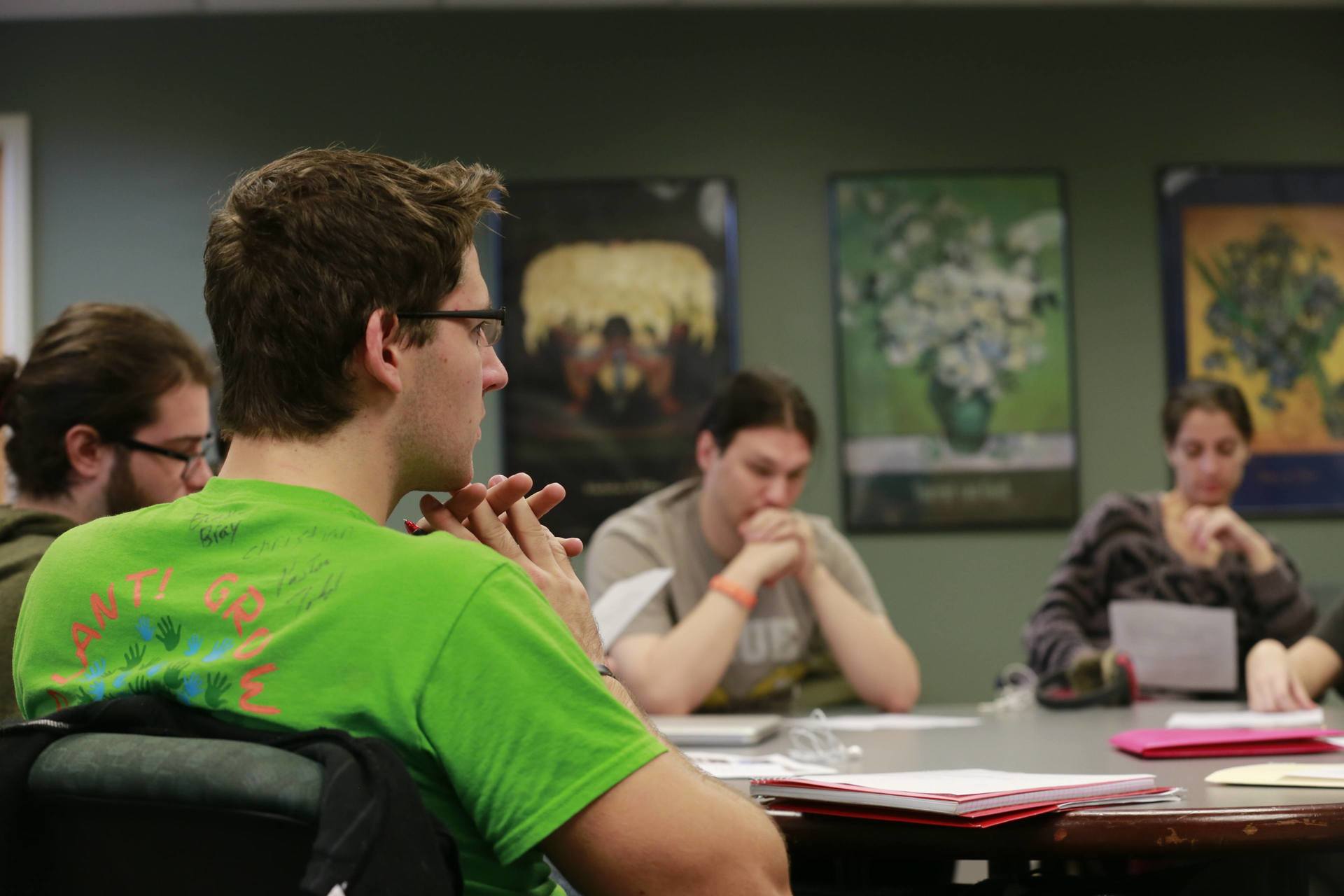 A group of students sitting around a table.