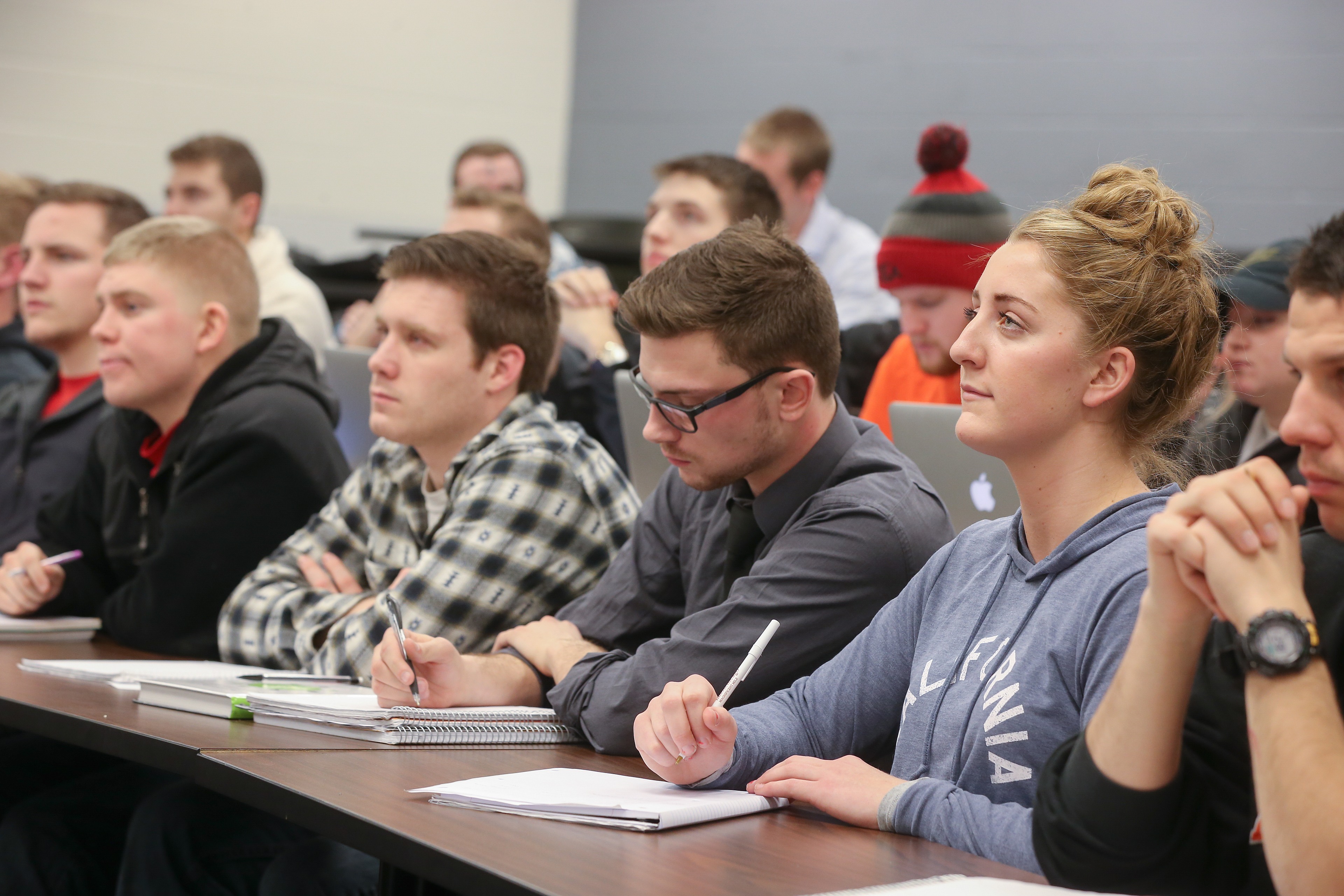 Students sitting and taking notes