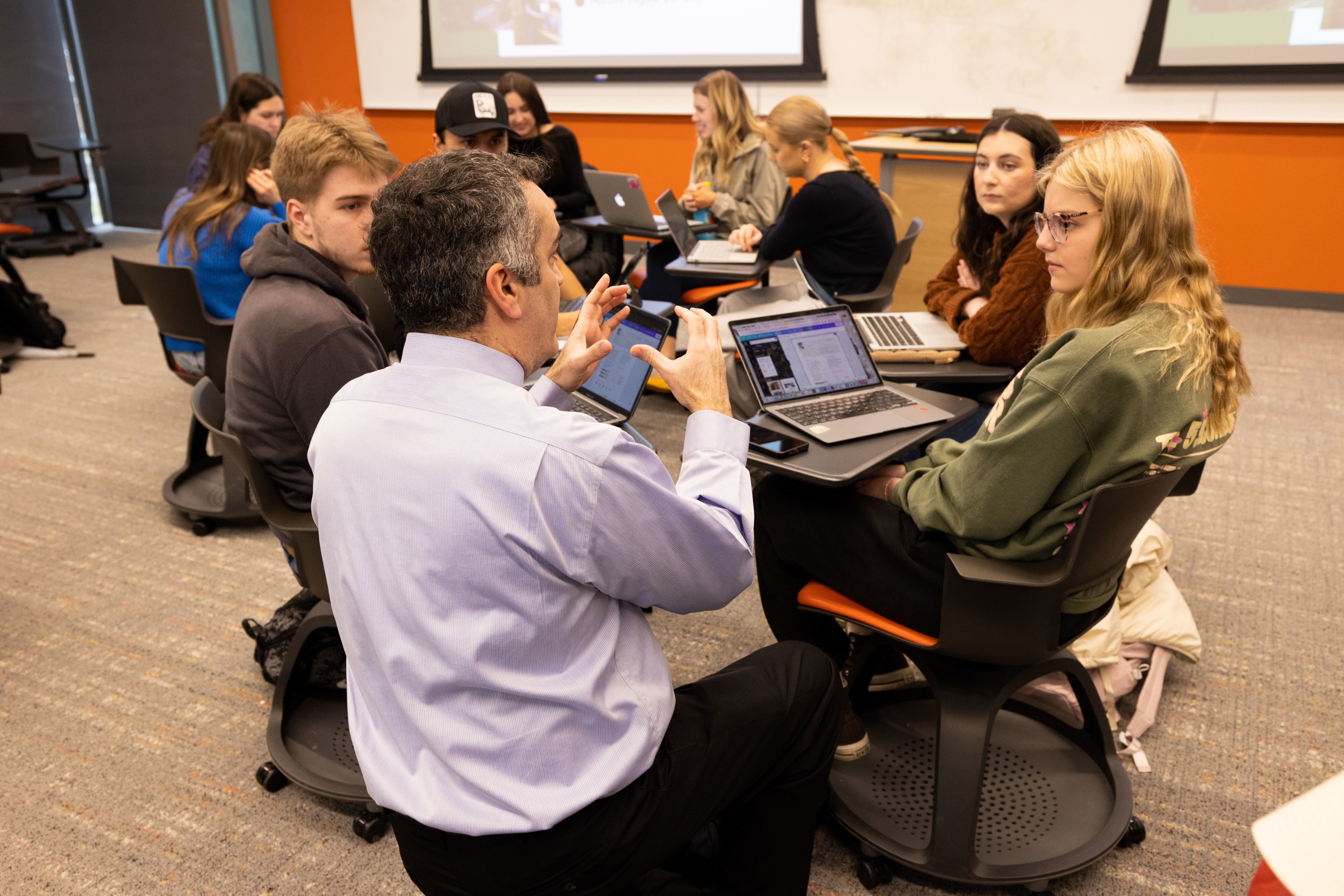 Teacher talking to a group of students