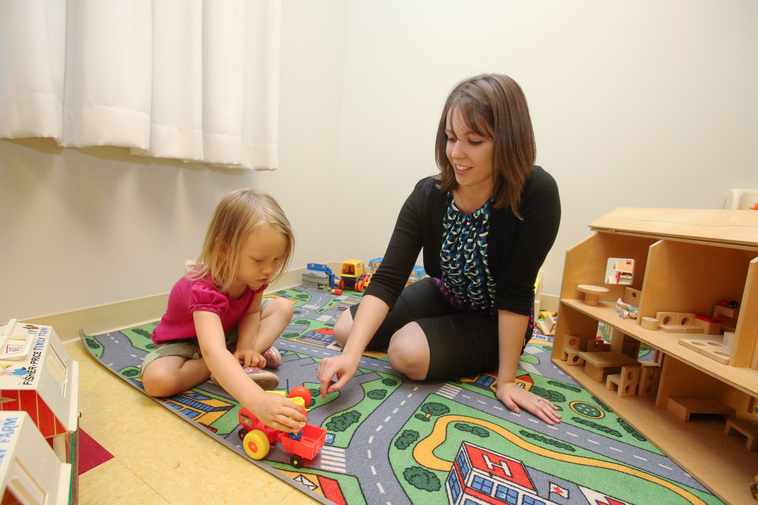 BGSU Developmental Psychology student interacting with a young child