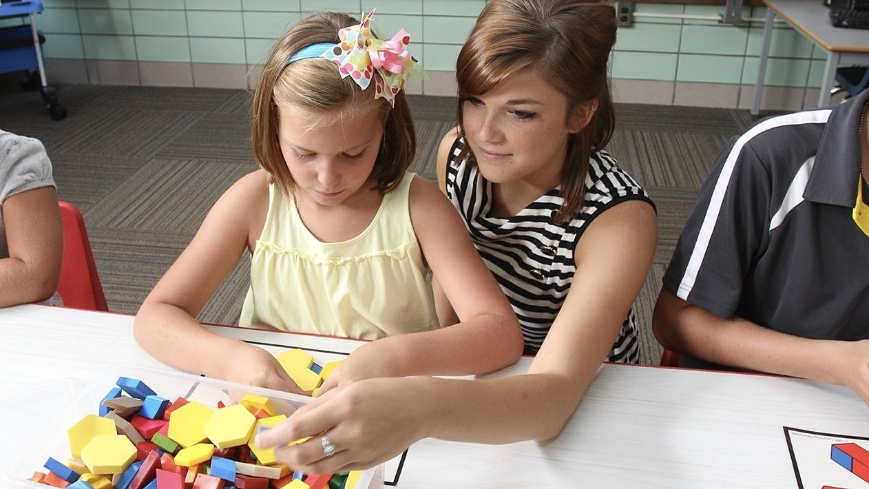 BGSU developmental psychology doctoral student working with children as she studies change over the lifespan.