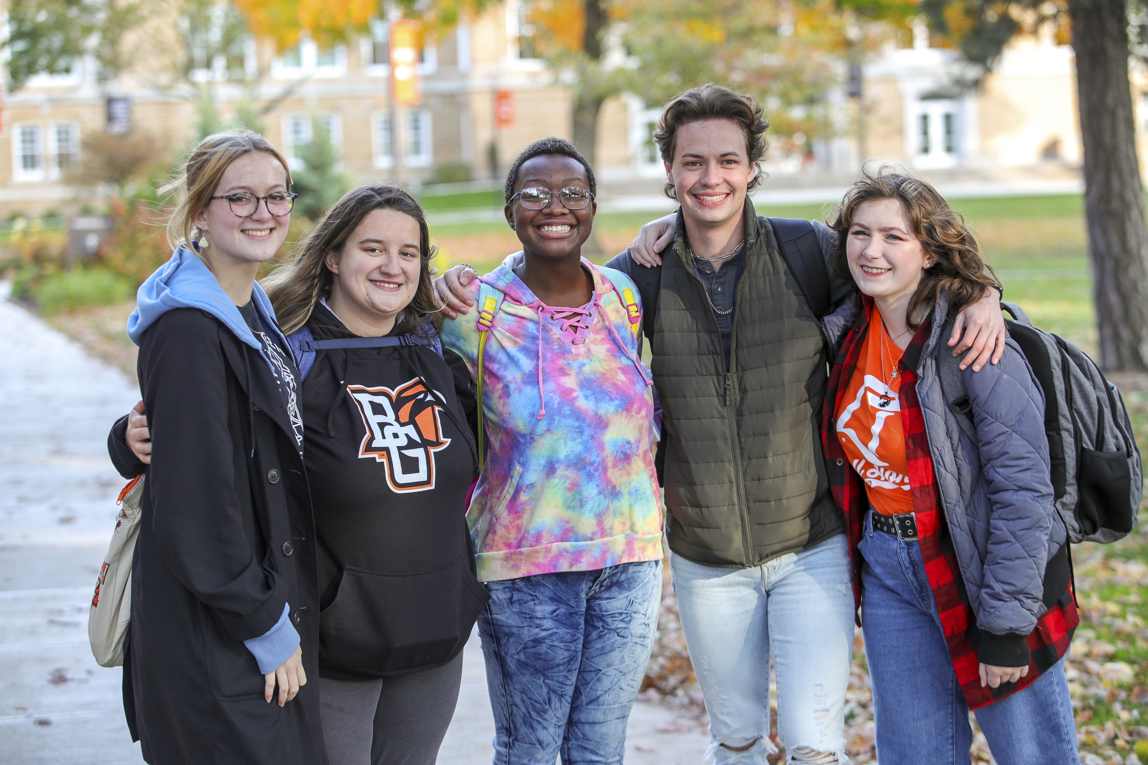 Group of BGSU students with their arms around each other