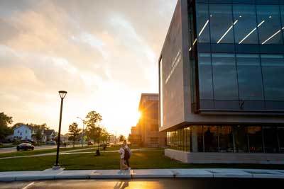 Students walking in front of the Maurer Center on BGSU's campus.