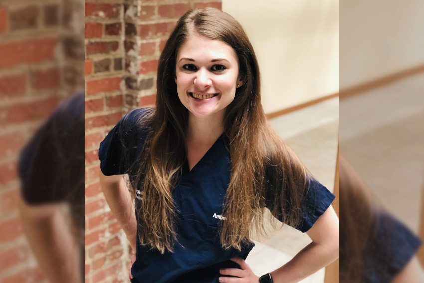 BGSU alumna Amber Gombash in hospital scrubs