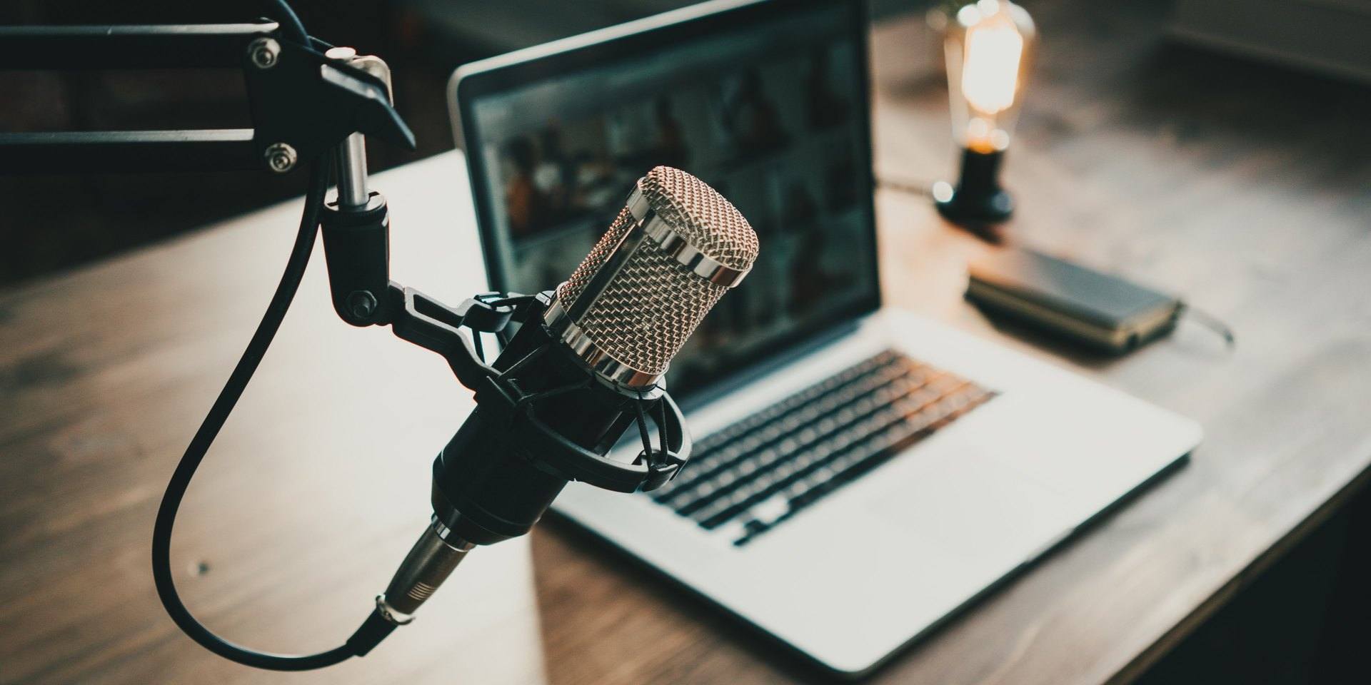 Podcast set-up with microphone and computer