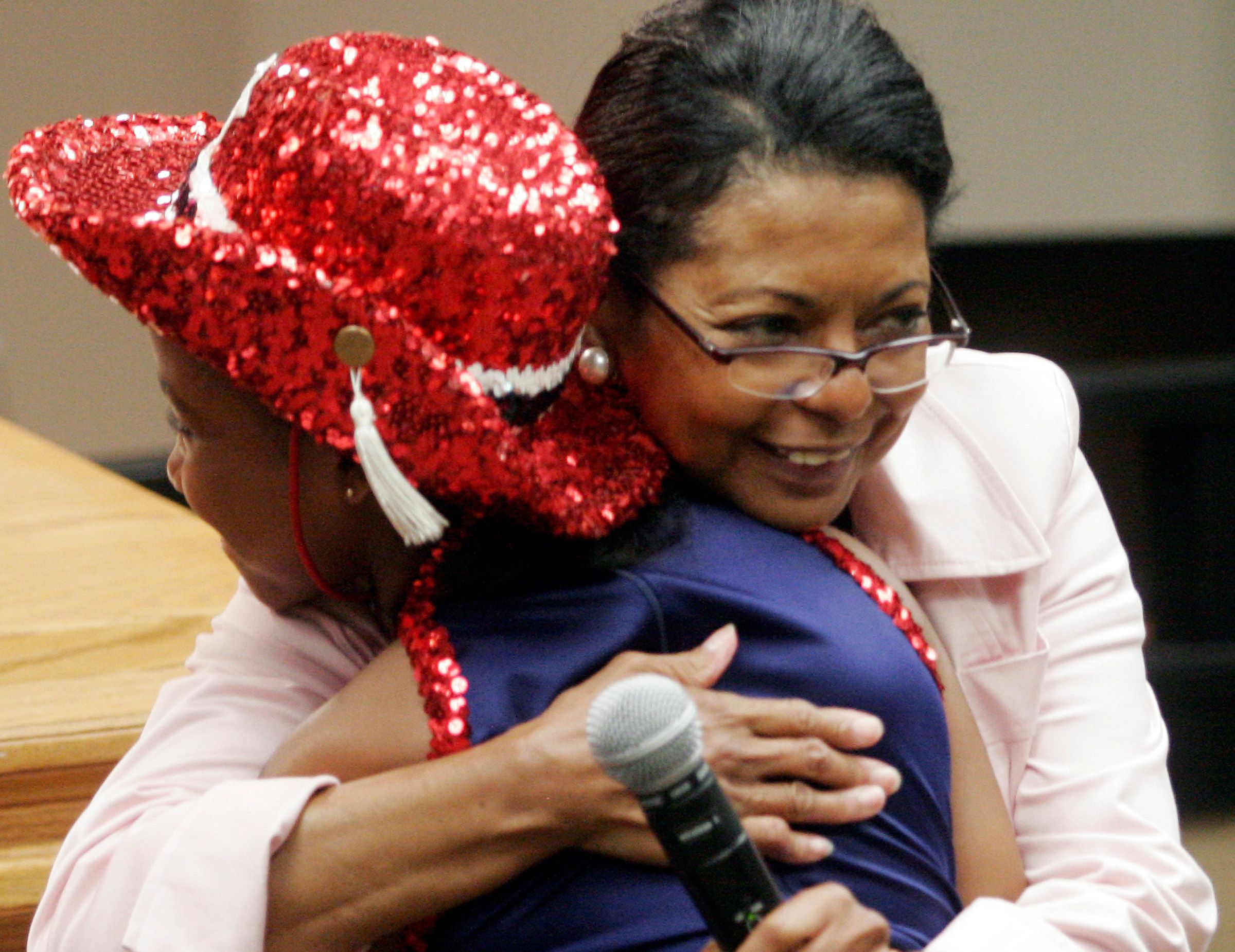 McLin hugging someone