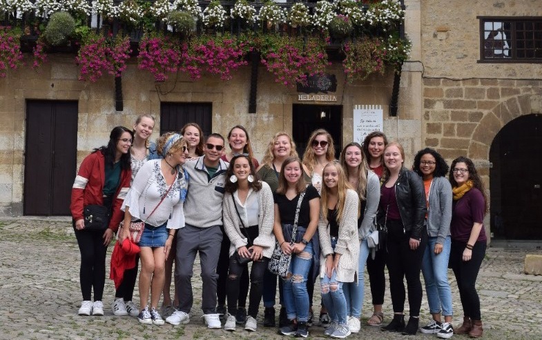 A group of people smiling at the camera.