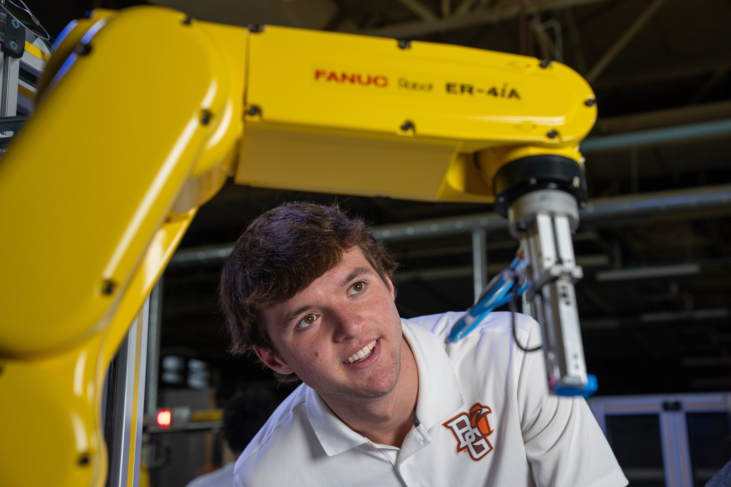 student working with robot