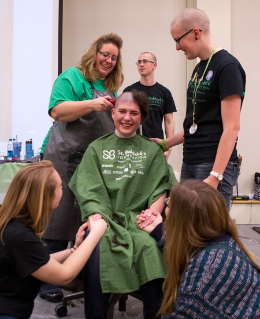 BGSU students support a classmate's generous decision to "go bald" at the annual St. Baldrick's event that raises funds aimed at conquering childhood cancer.