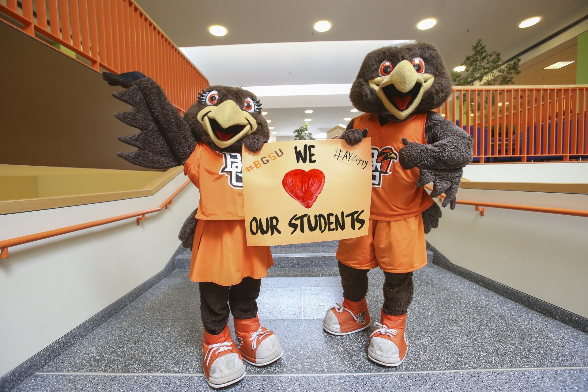 Freddie and Freida holding we heart our students