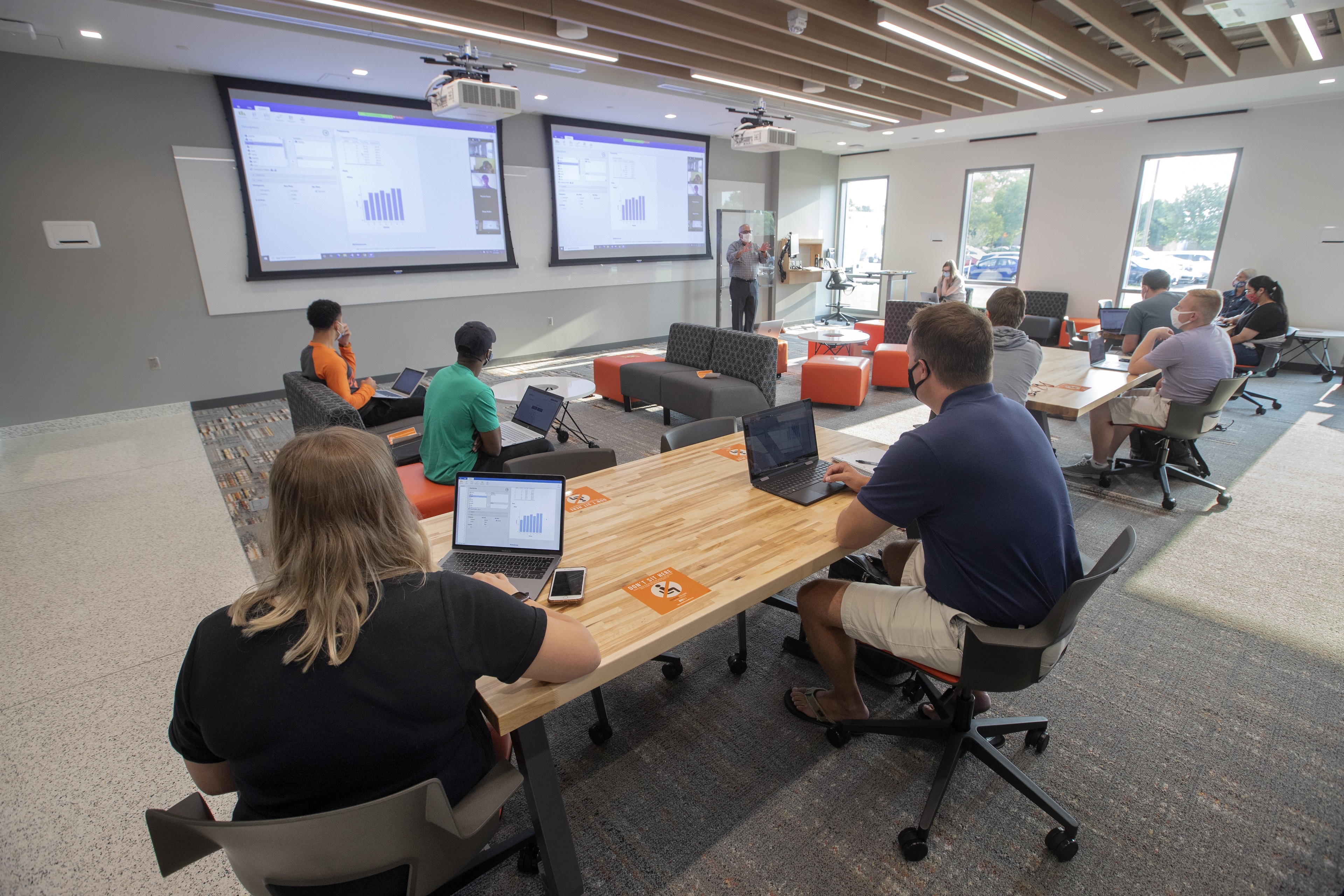 Cameras enable virtual attendance and participation in Finance 3000 class