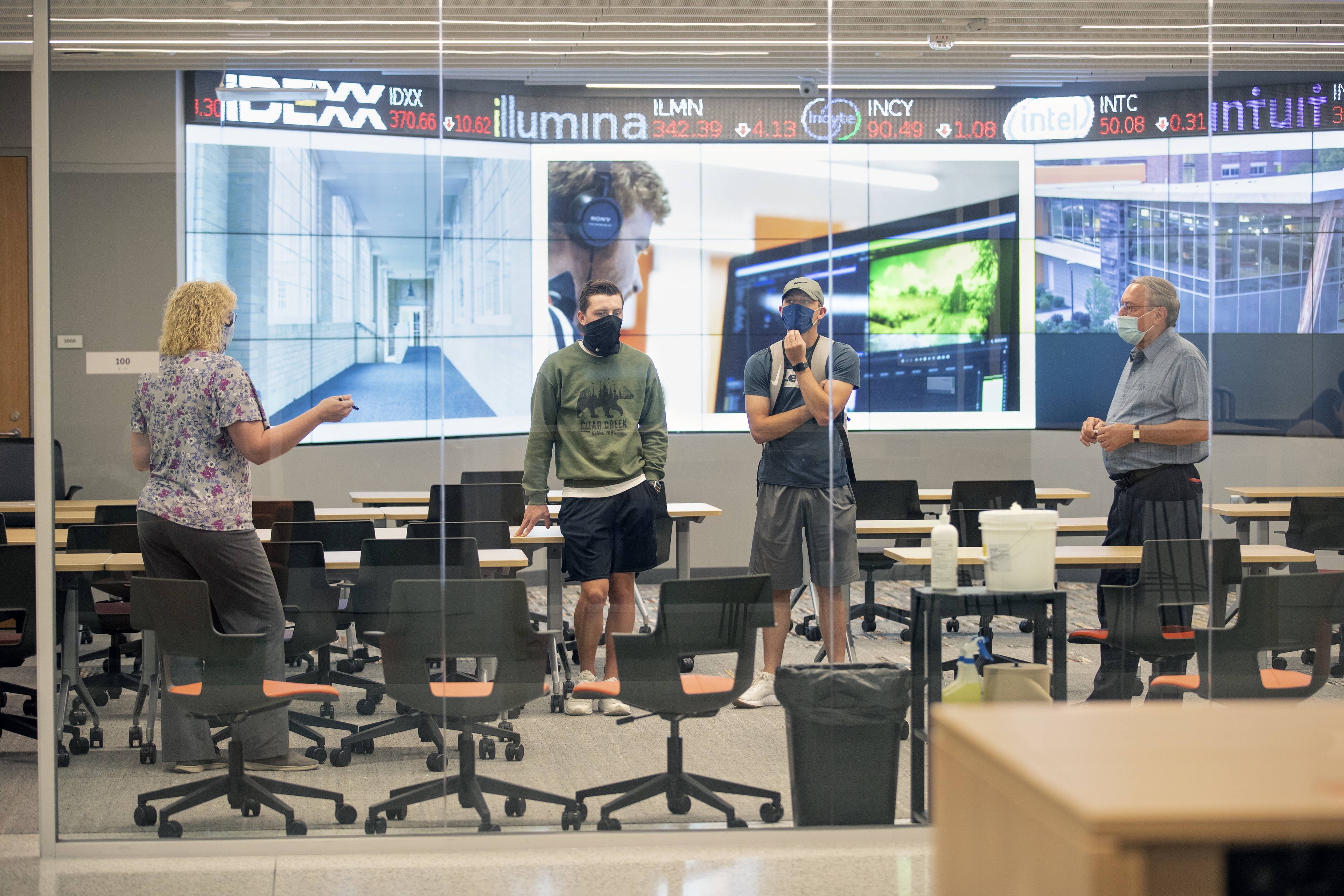 Michelle Roehl, left, and David Chatfield, far right, give a tour of the Maurer Center to prospective graduate students.