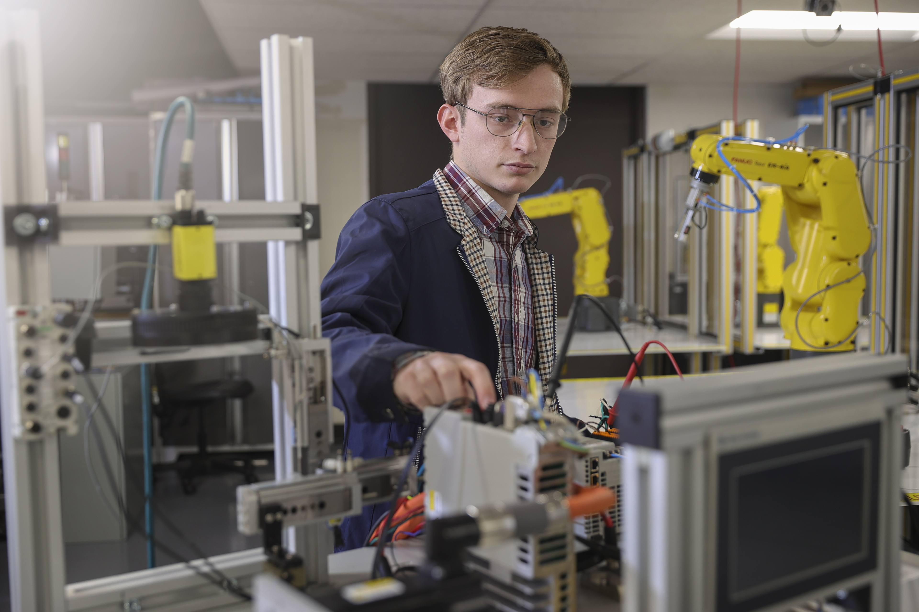 Ian Kennedy demonstrating his knowledge in robotics