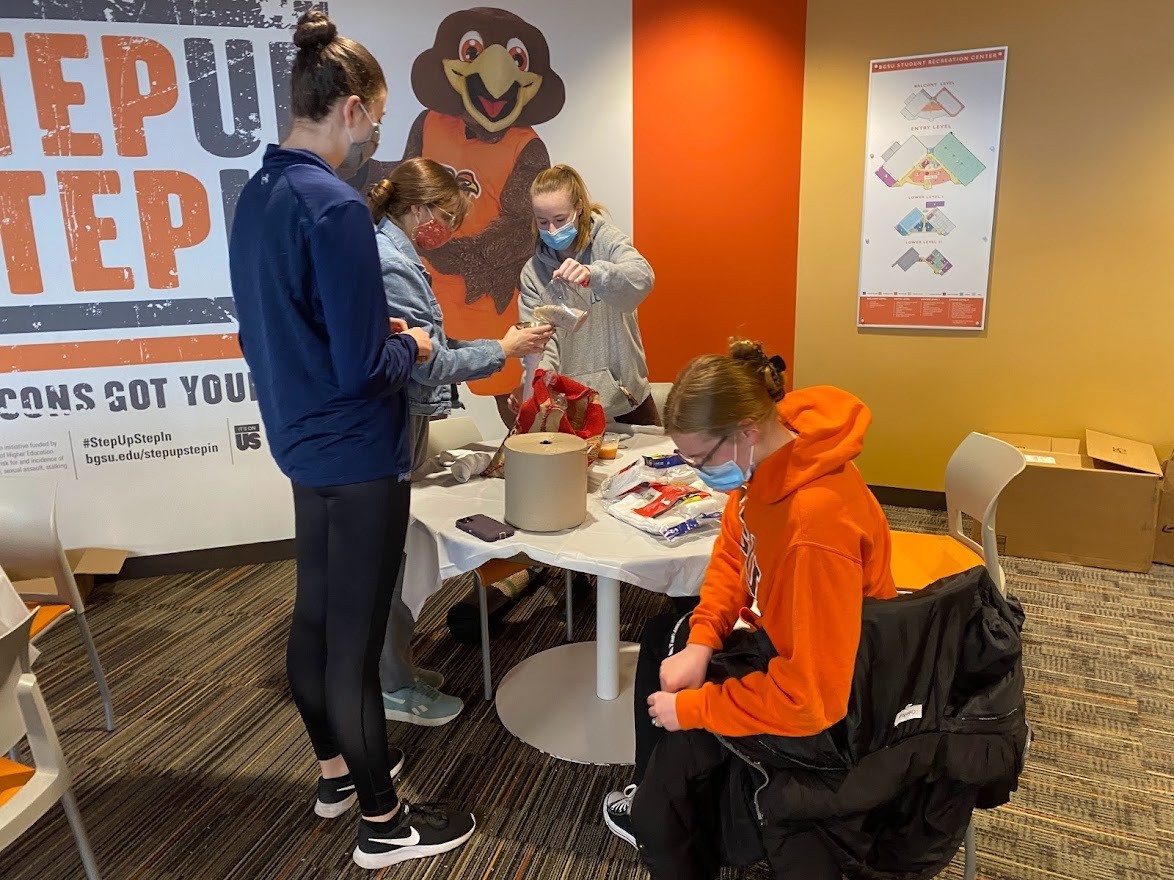A group of students making rice heating pads