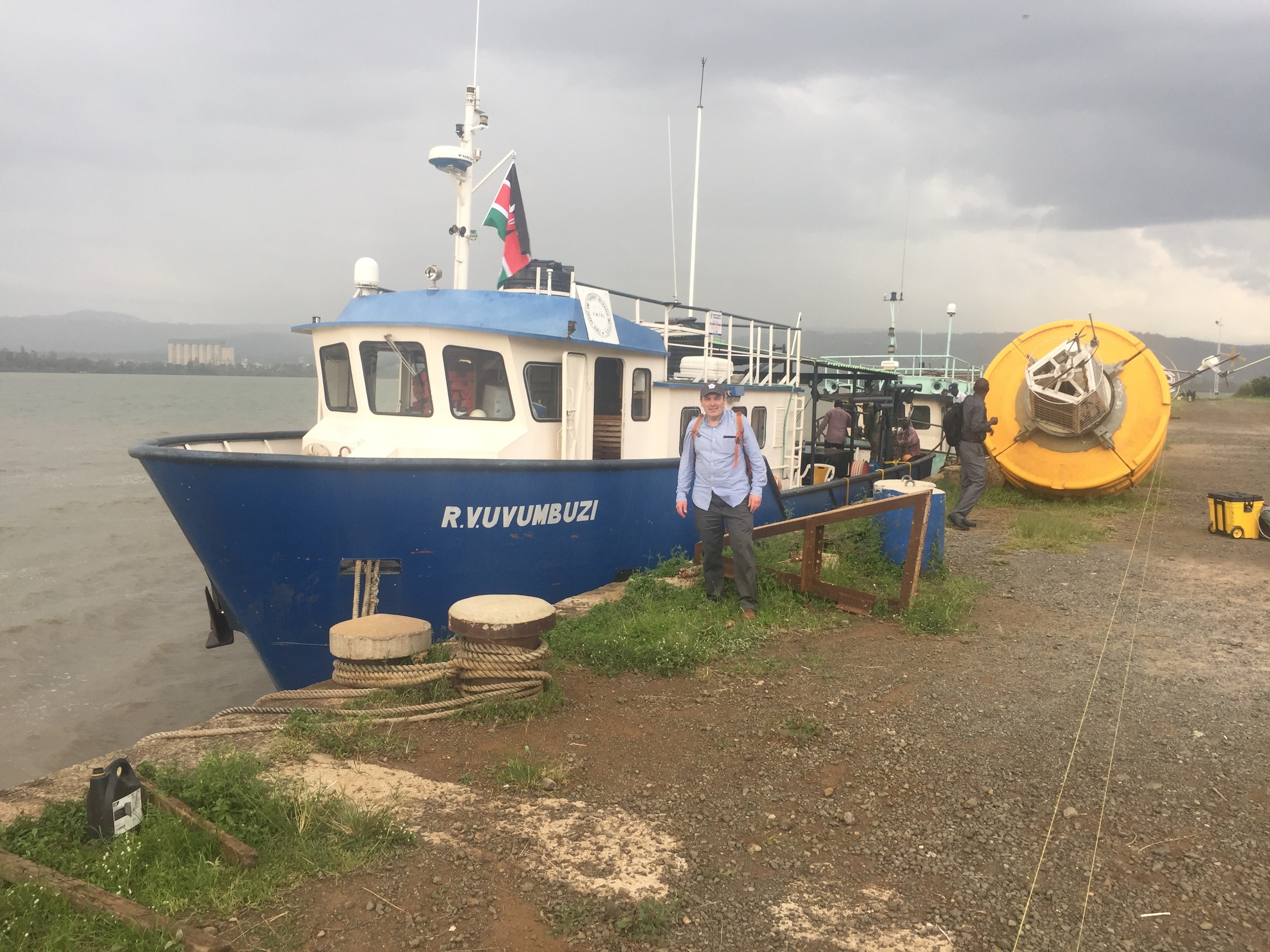 BGSU research professor Mike McKay stands in front of the Vuvumbuzi ship