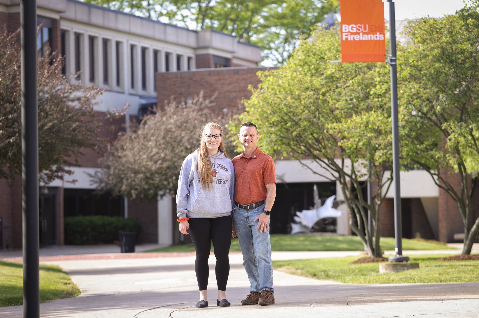 Emily and Michael Werner walk in the BGSU Firelands courtyard in Huron, Ohio.