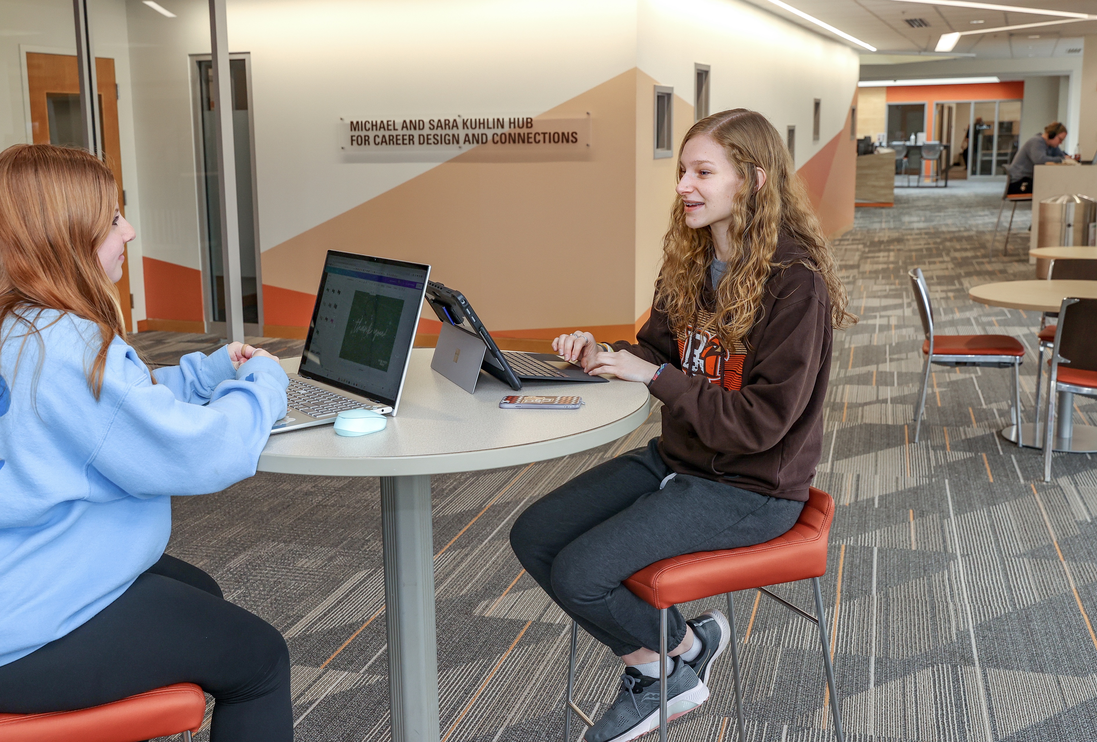 students sitting and talking at the Kuhlin Career Hub