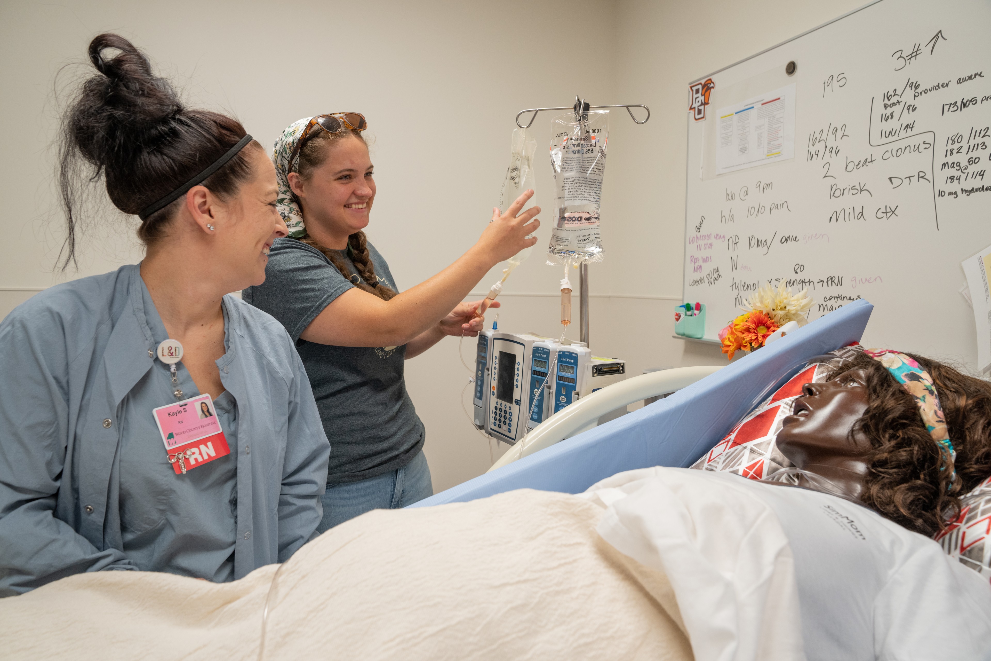 Two people in a nursing simulation lab