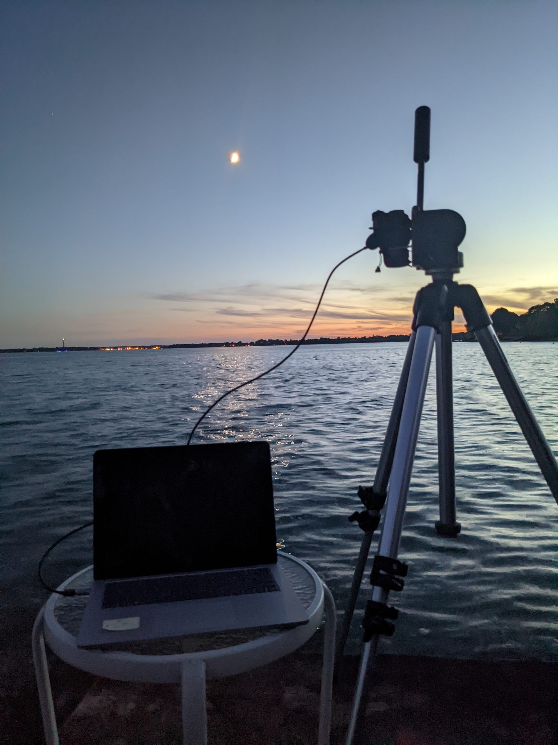 Infrared camera sits on a deck as sun sets