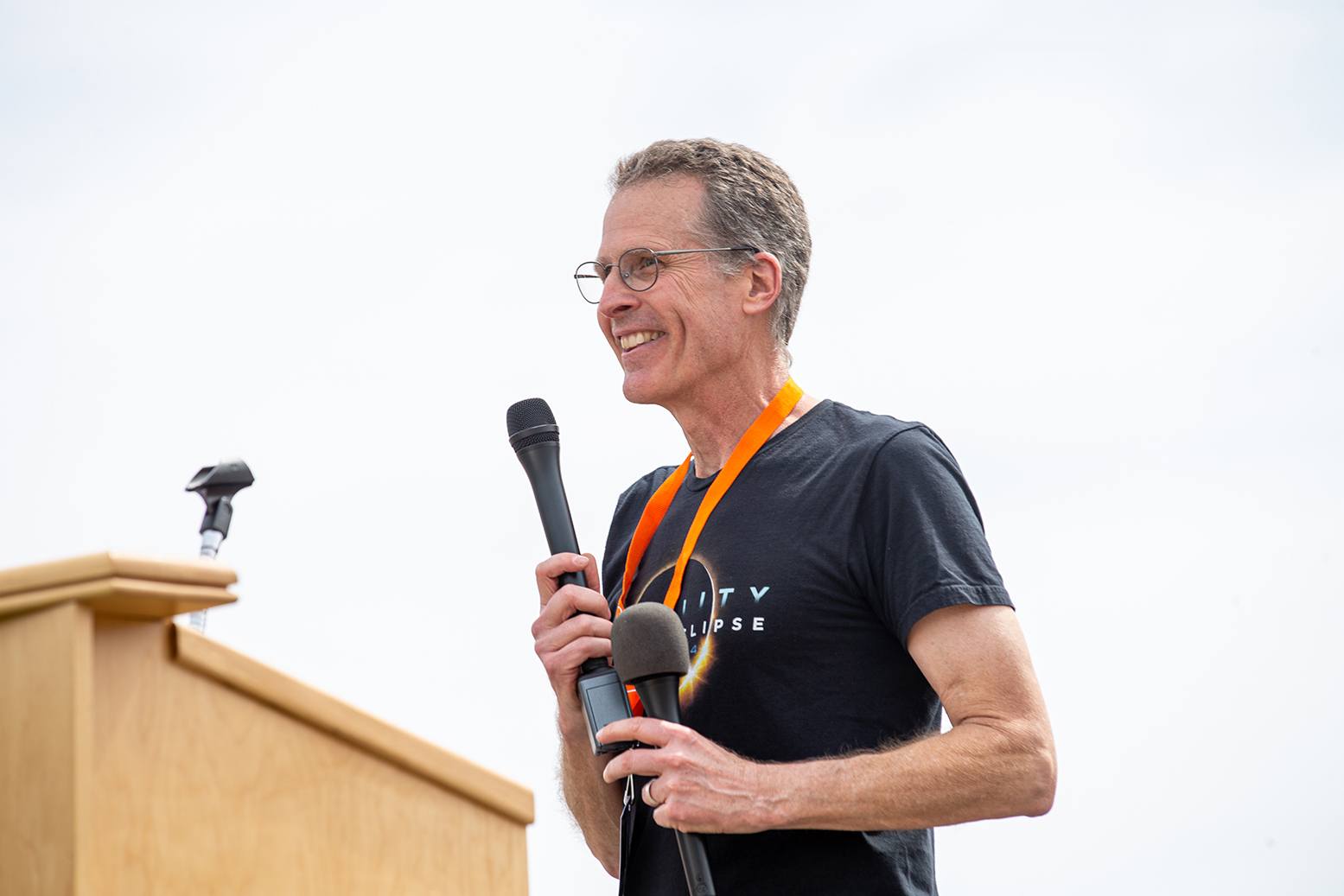 Dr. Andrew Layden stands at a podium