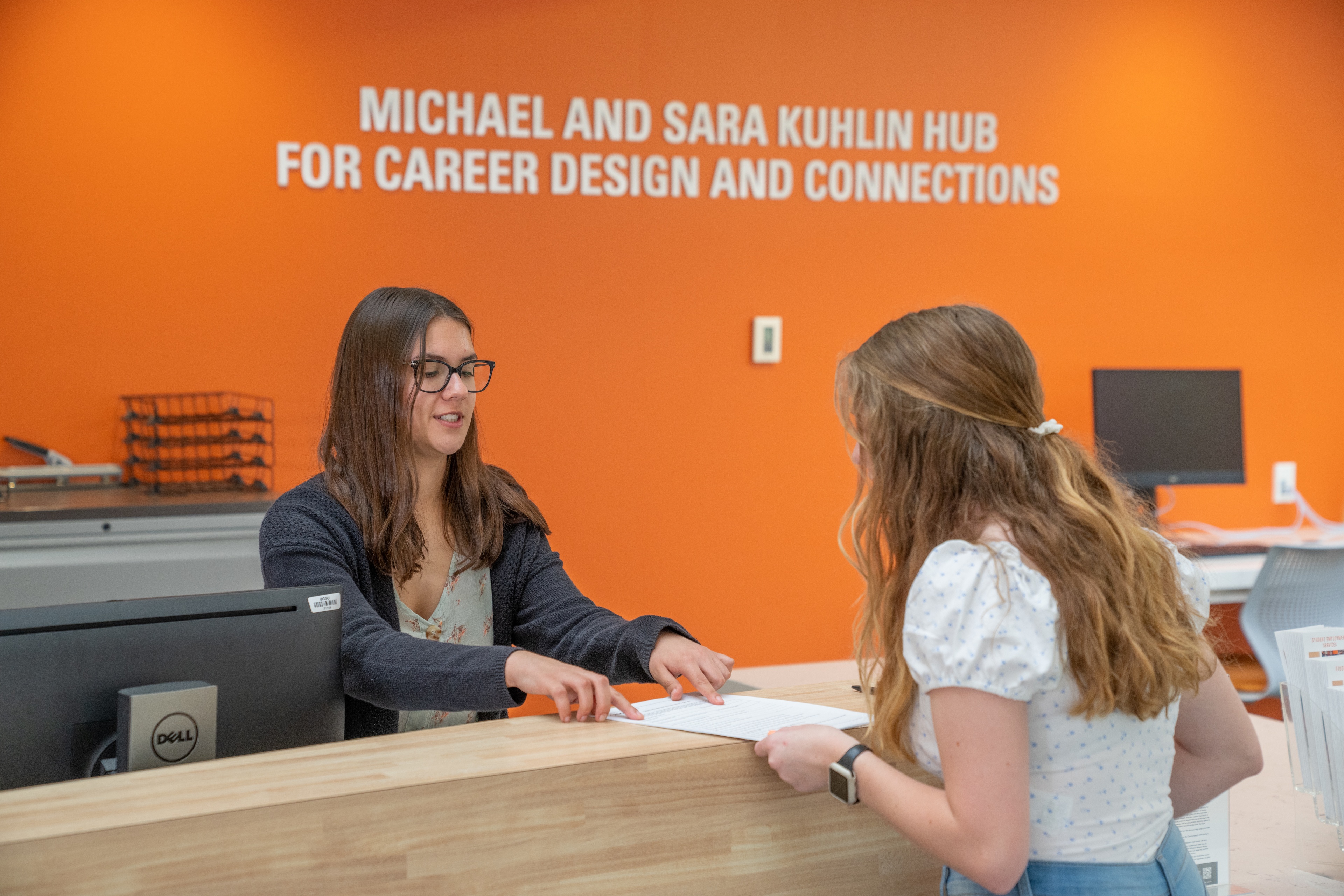 Student worker helping a student with on boarding for on-camous employment