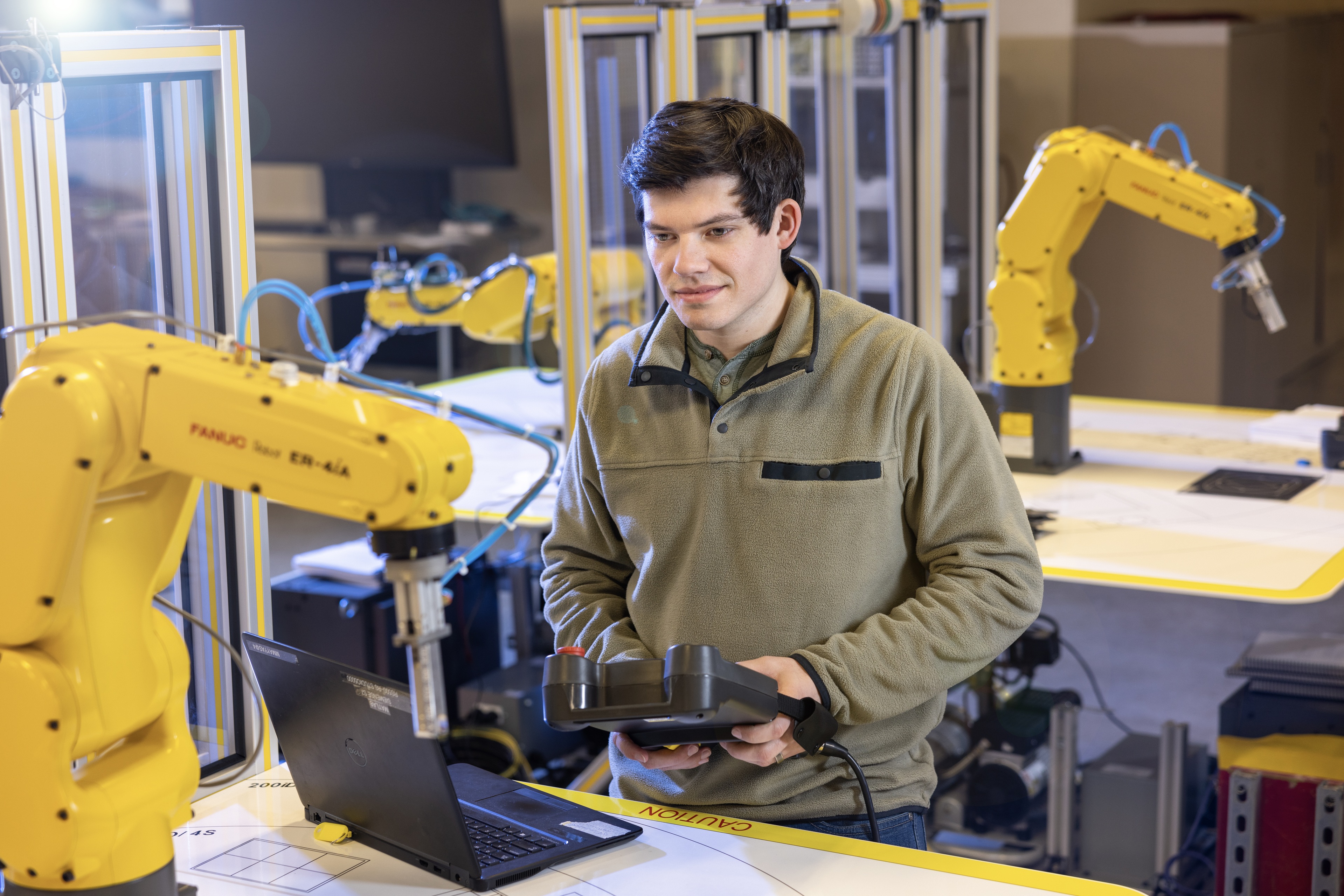 BGSU student working in a mechatronics engineering lab.