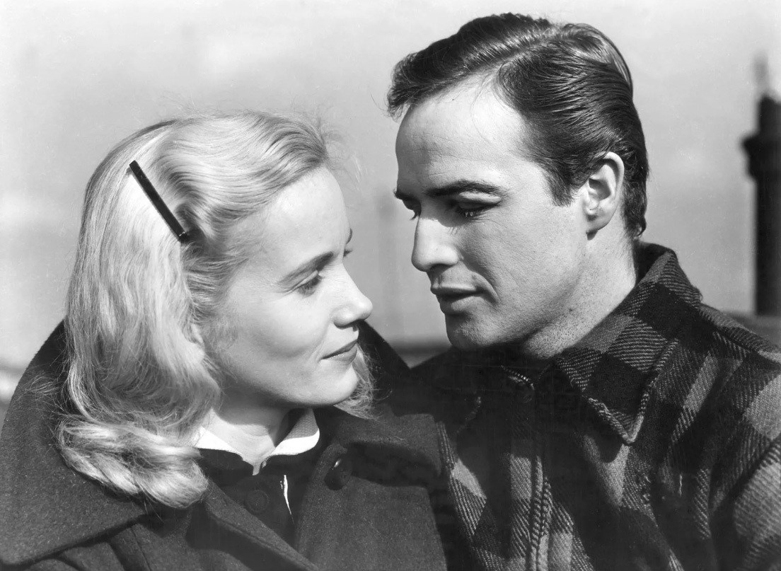 Actress Eva Marie Saint and actor Marlon Brando look at each other in a scene from the On The Waterfront movie
