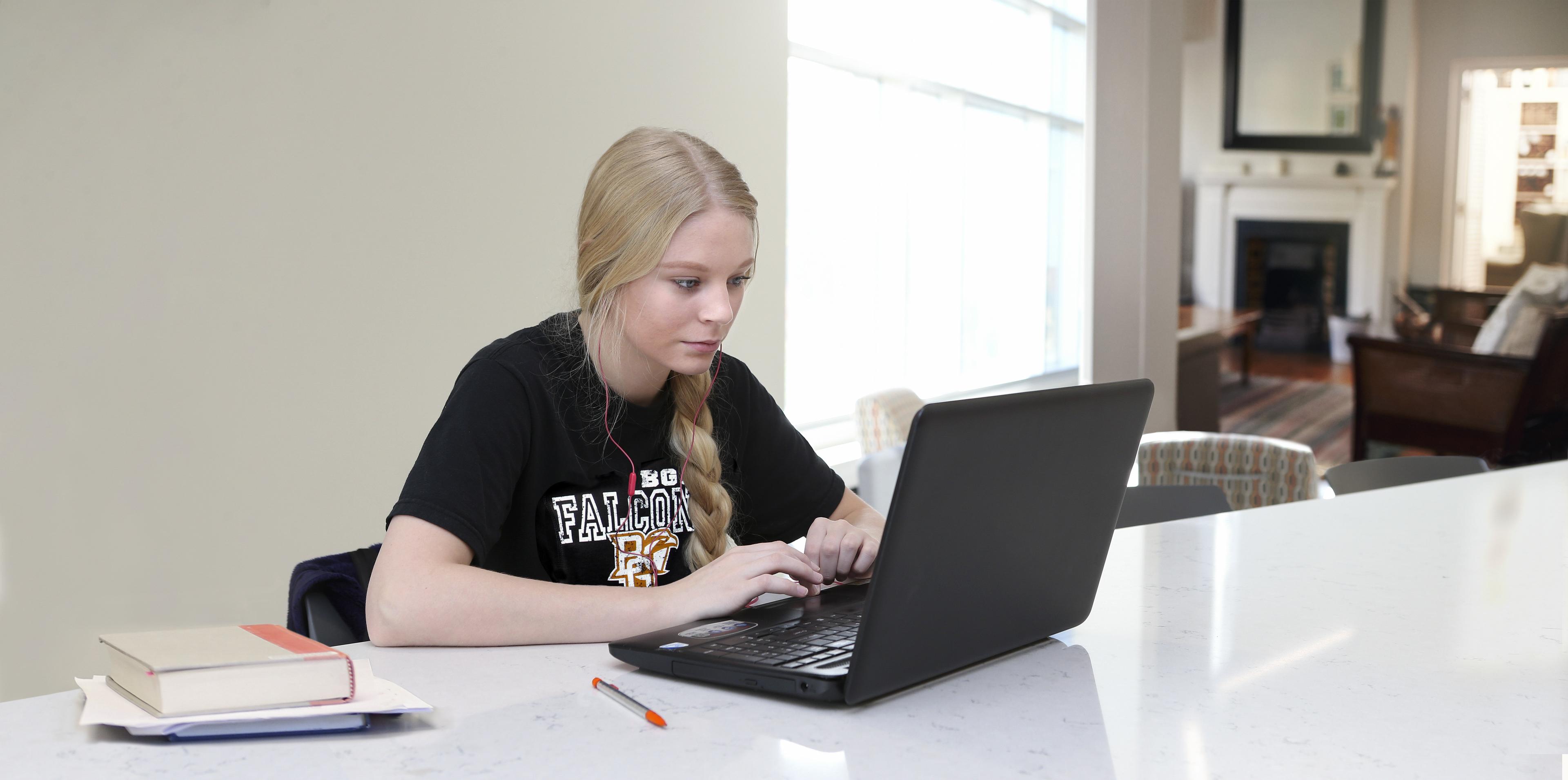 A person uses a laptop.