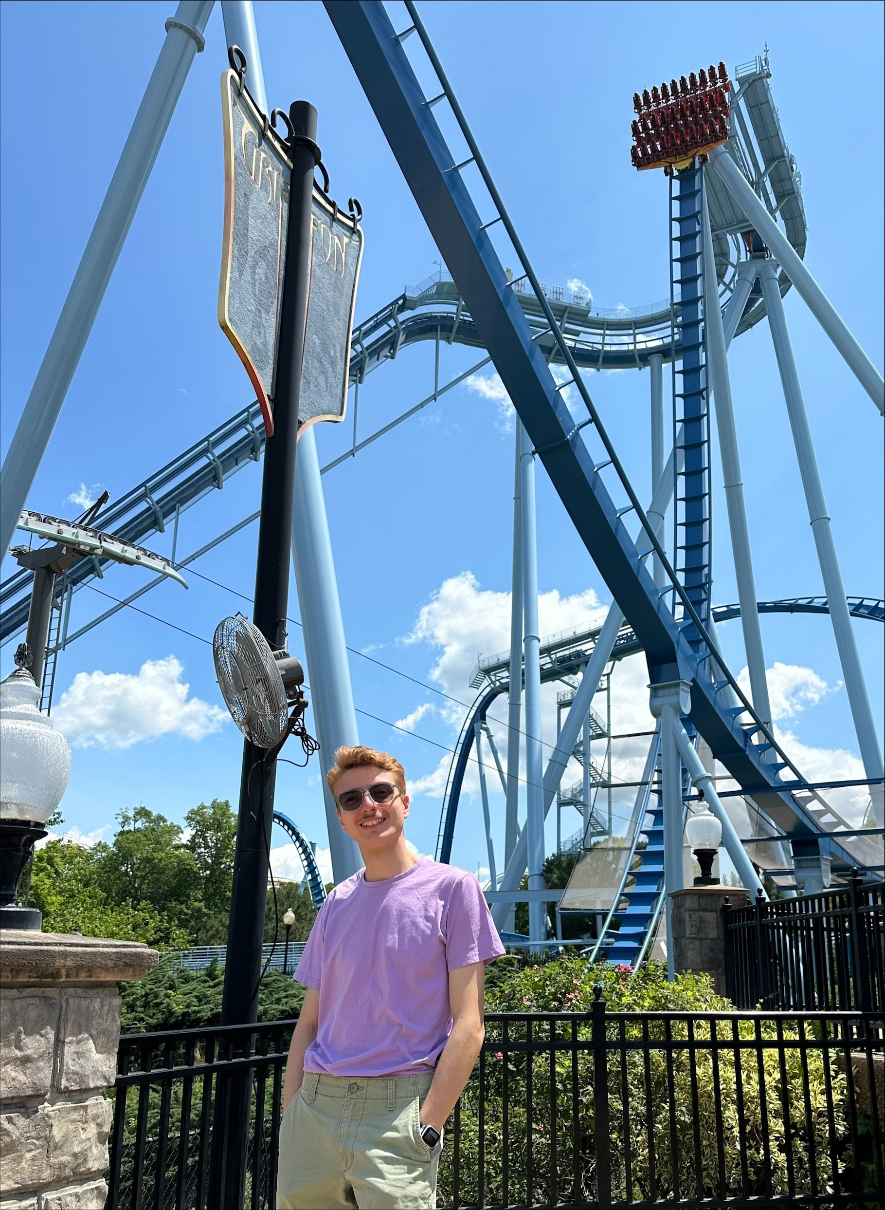 Theme park employees pose for a picture.