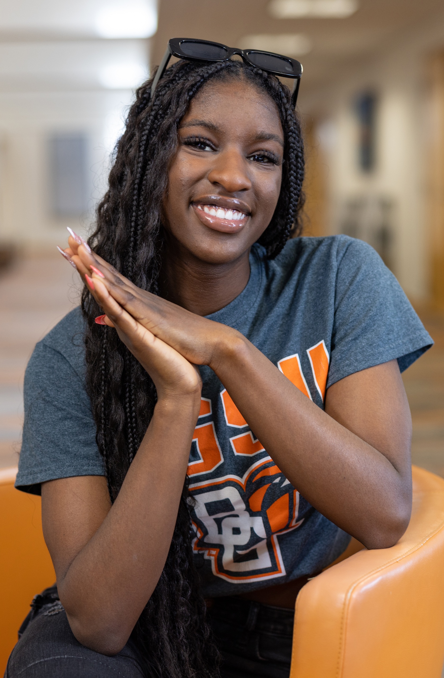 Student smiles and poses for camera.