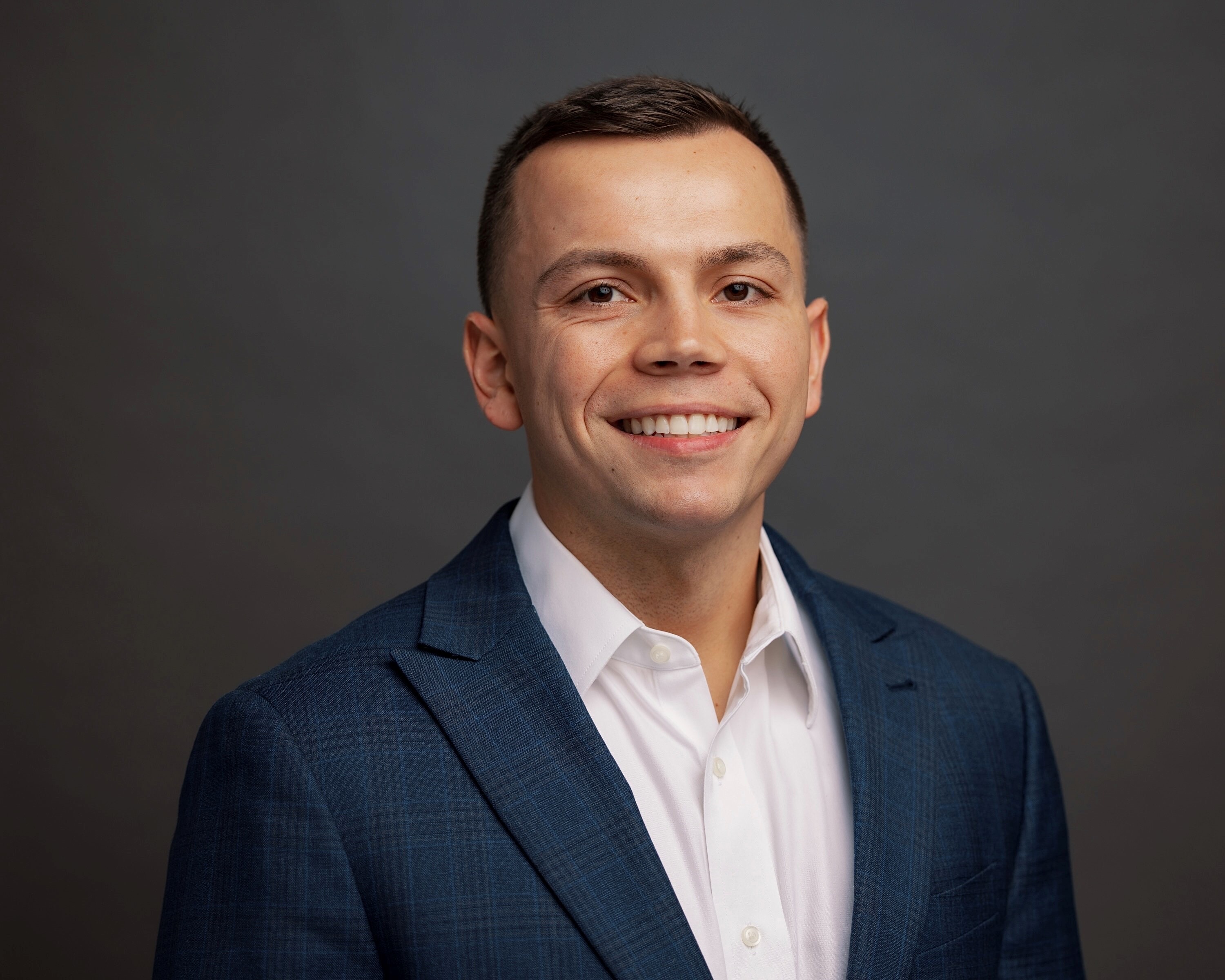 A professional headshot of Alex Vargo