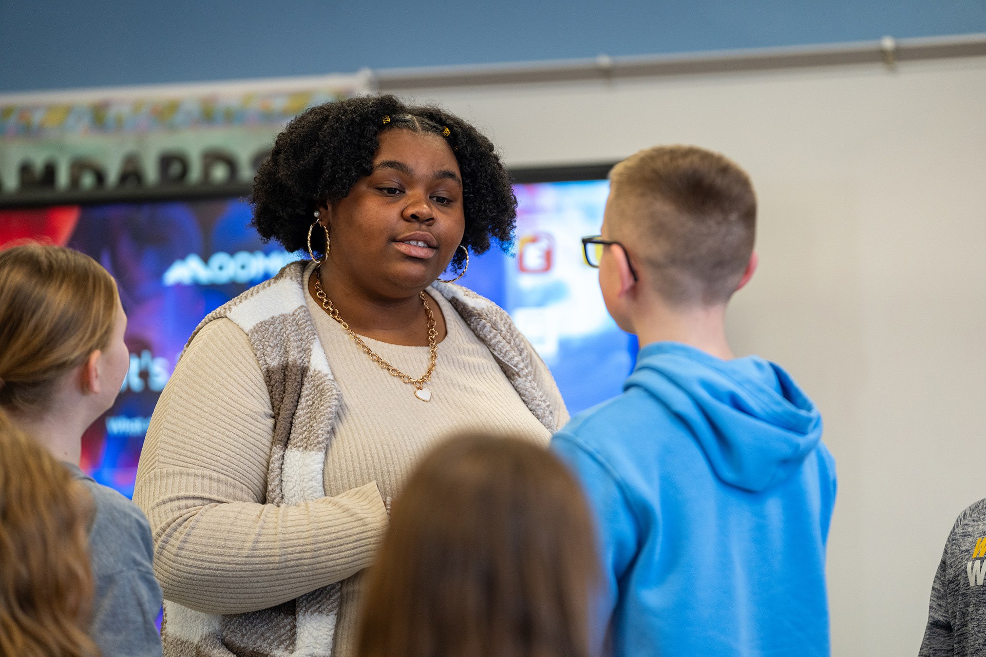 Teacher talks to students in class