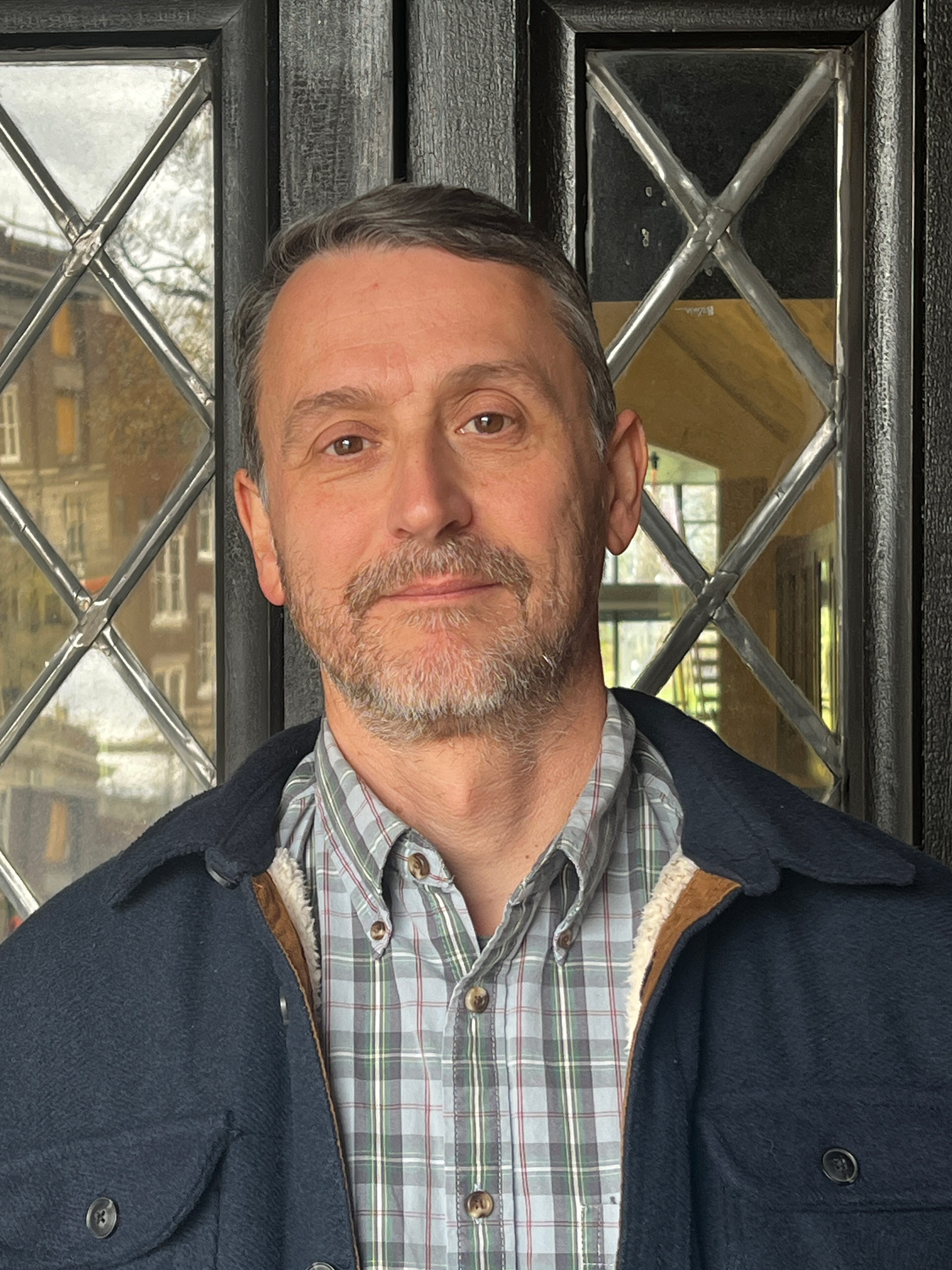 A man poses for a photo. 