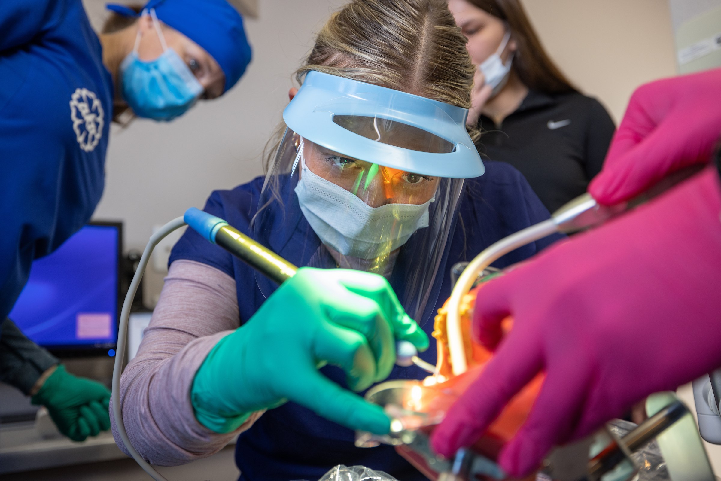 A pre-dental student practices skills