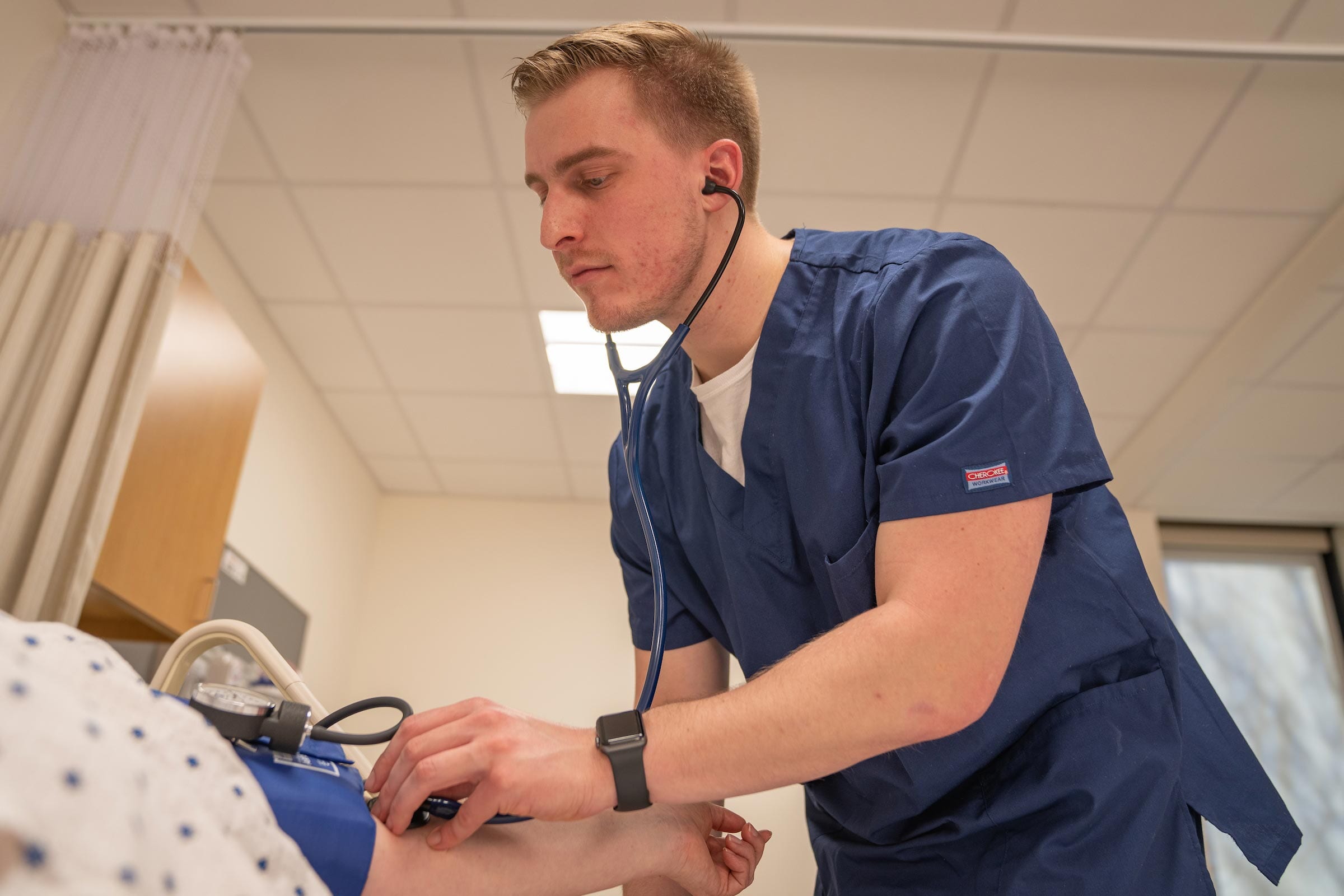 A nurse tends to a patient