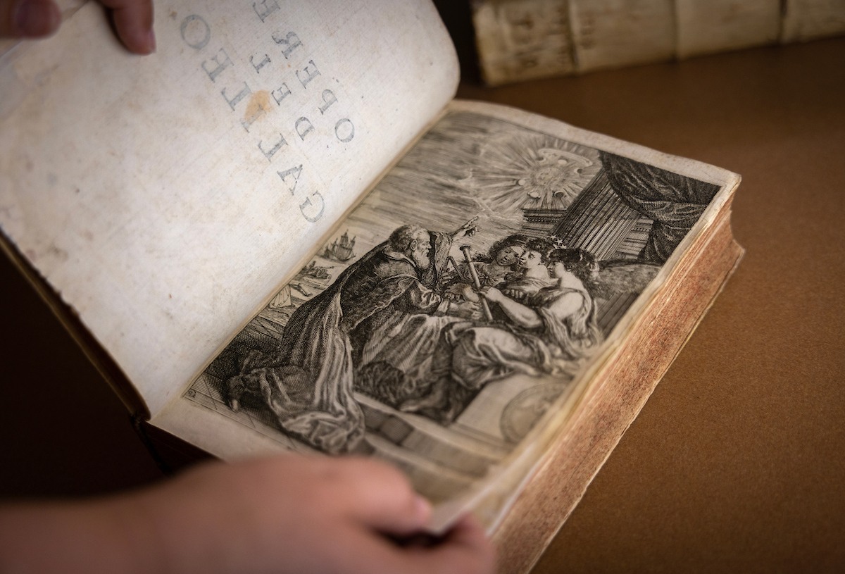 An illustration is shown inside a book 