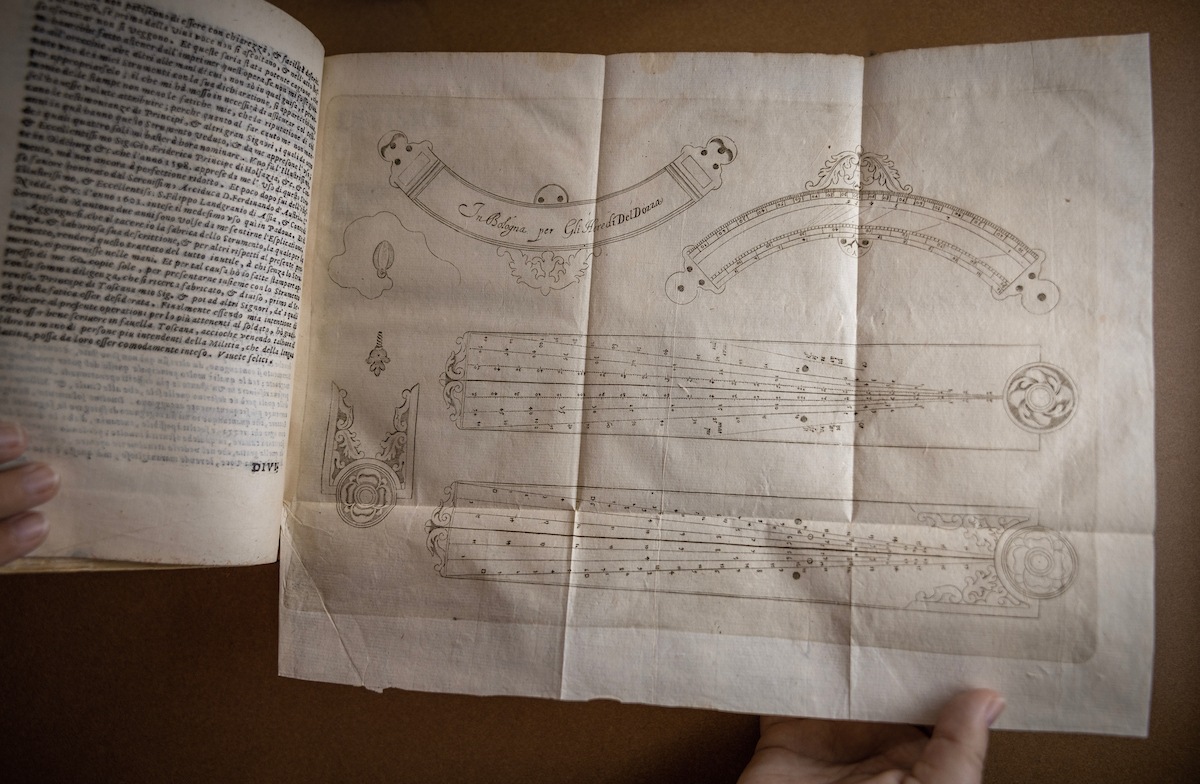 An illustration is shown inside a book