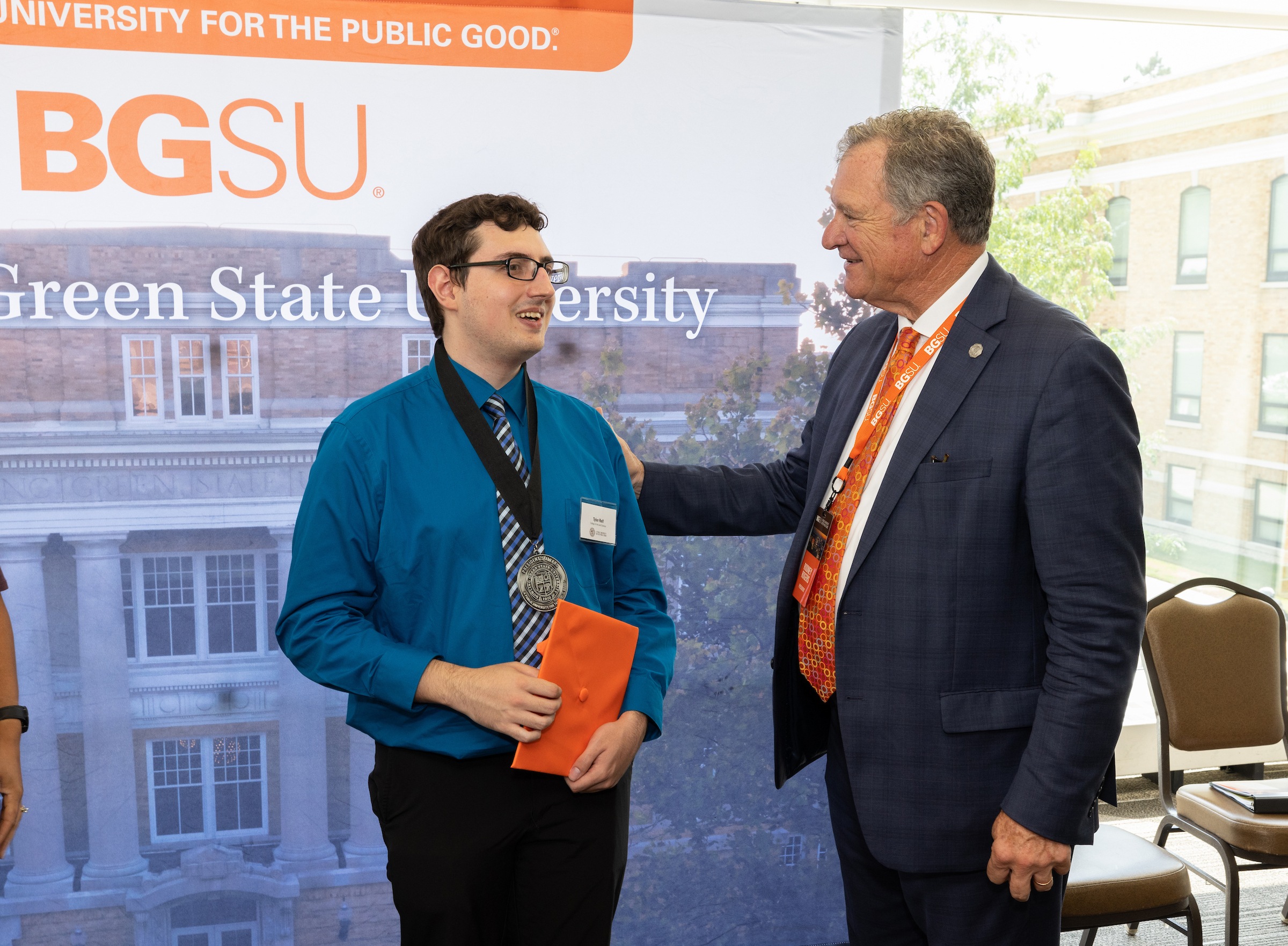 A student speaks with BGSU president Rodney K. Rogers