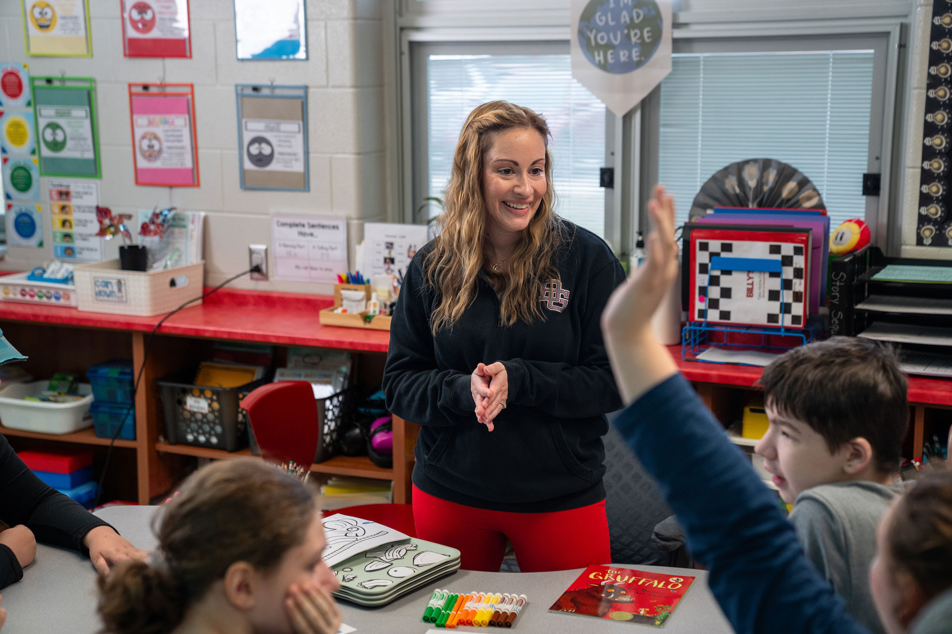 An intervention specialist talks to students.