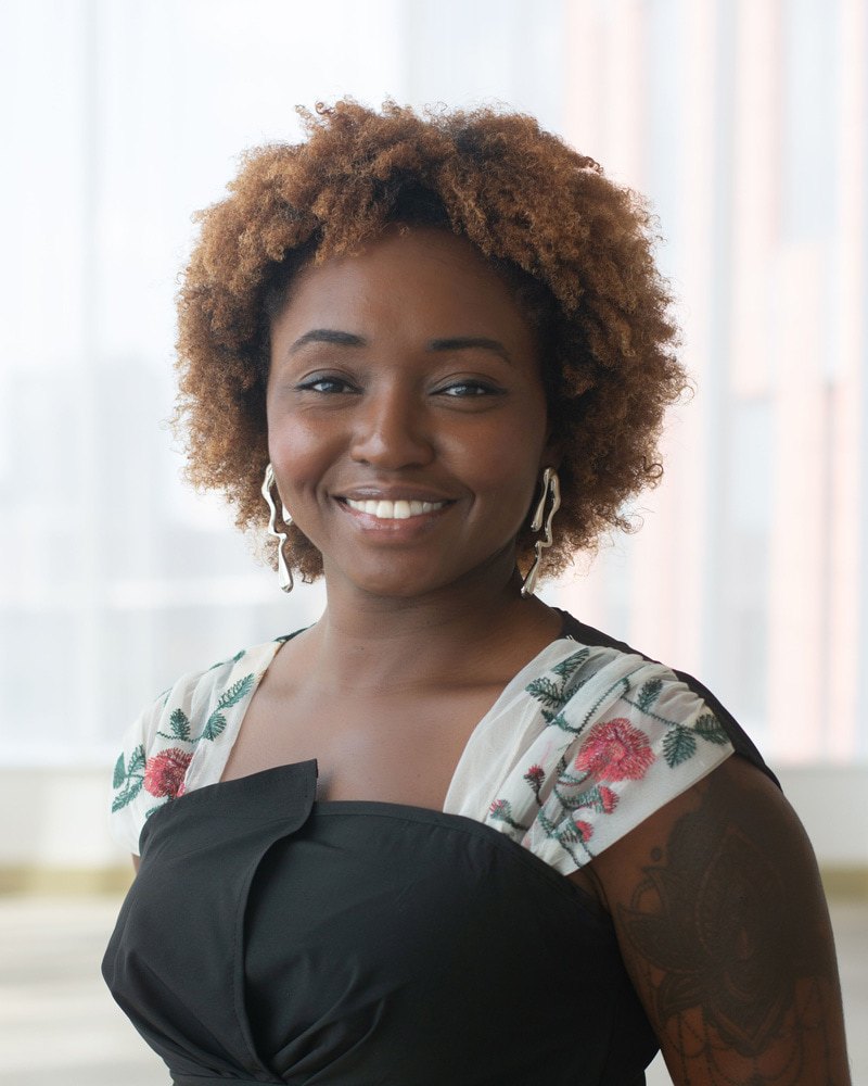 A woman poses for a picture