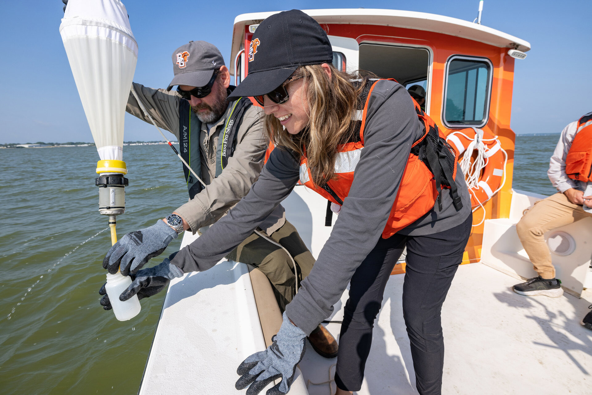 Researchers study a water sample.
