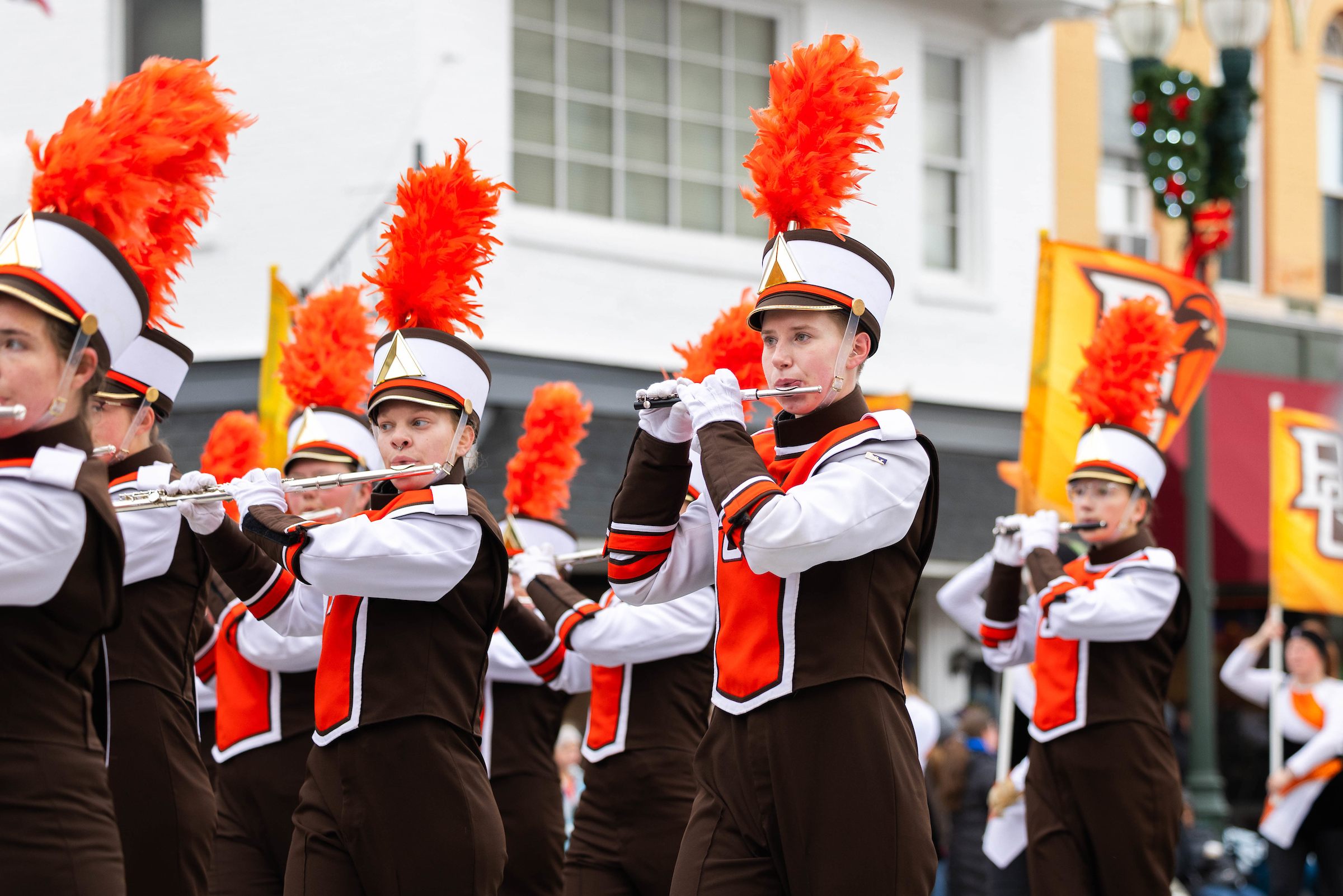 BGSU Falcon Marching Band members perform at the 2024 BG Holiday Parade.