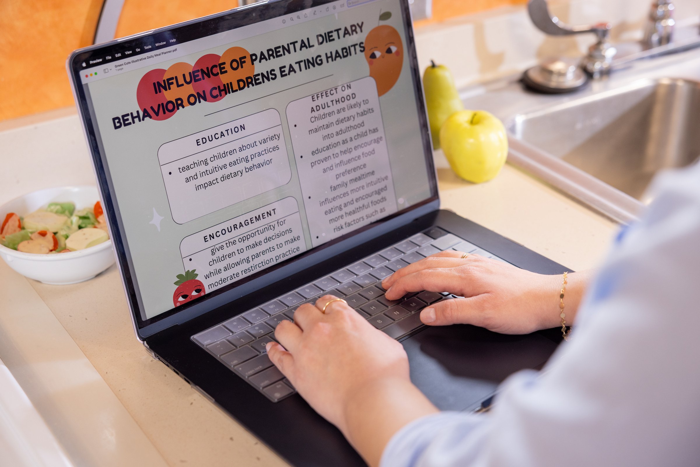A computer screen shows a presentation on children's eating habits.
