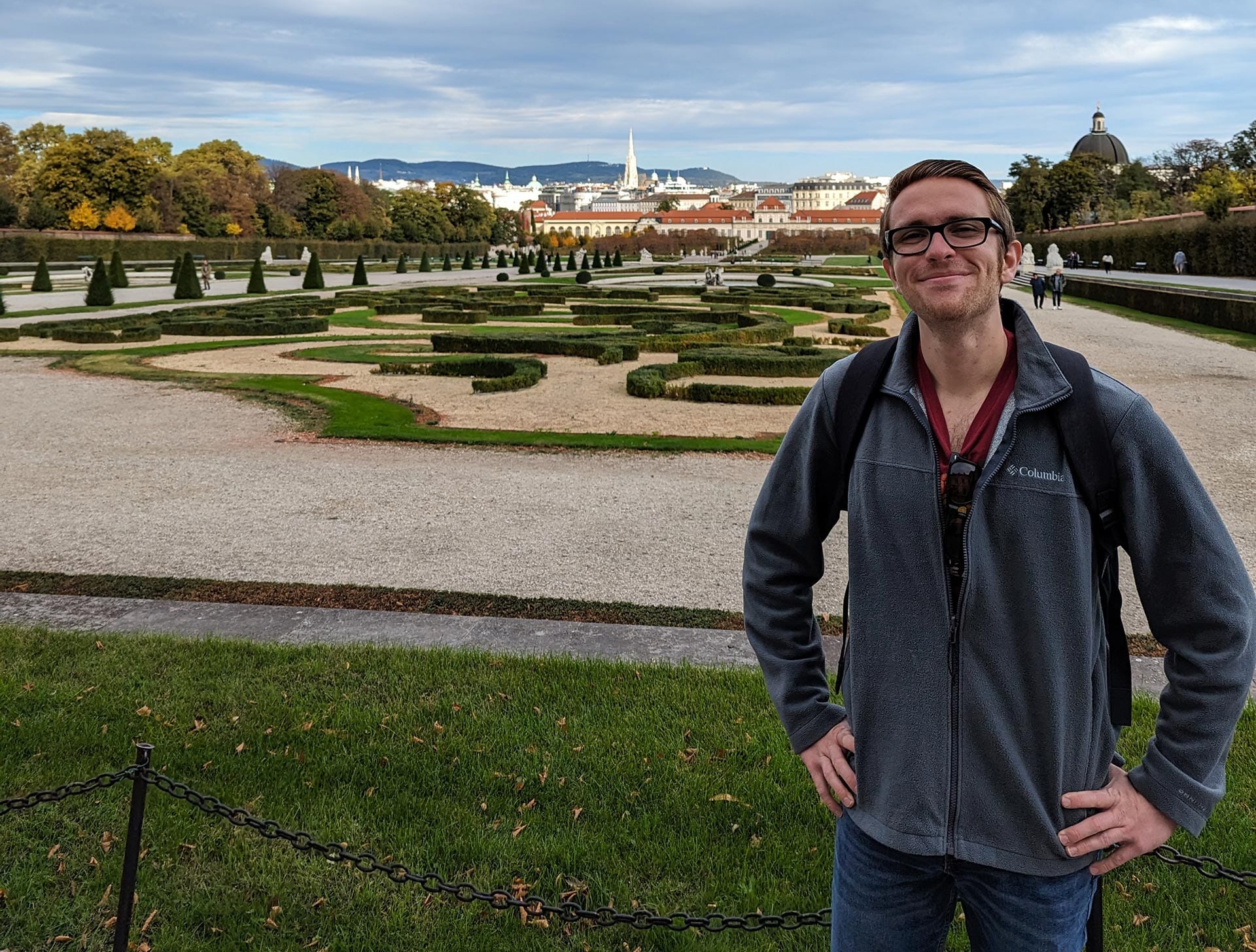 A man poses for a picture outdoors
