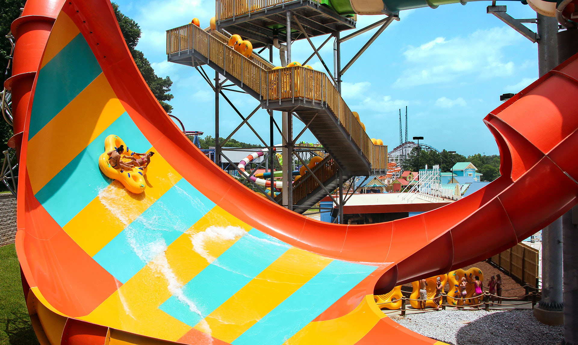 Two people sitting on a raft on a water ride