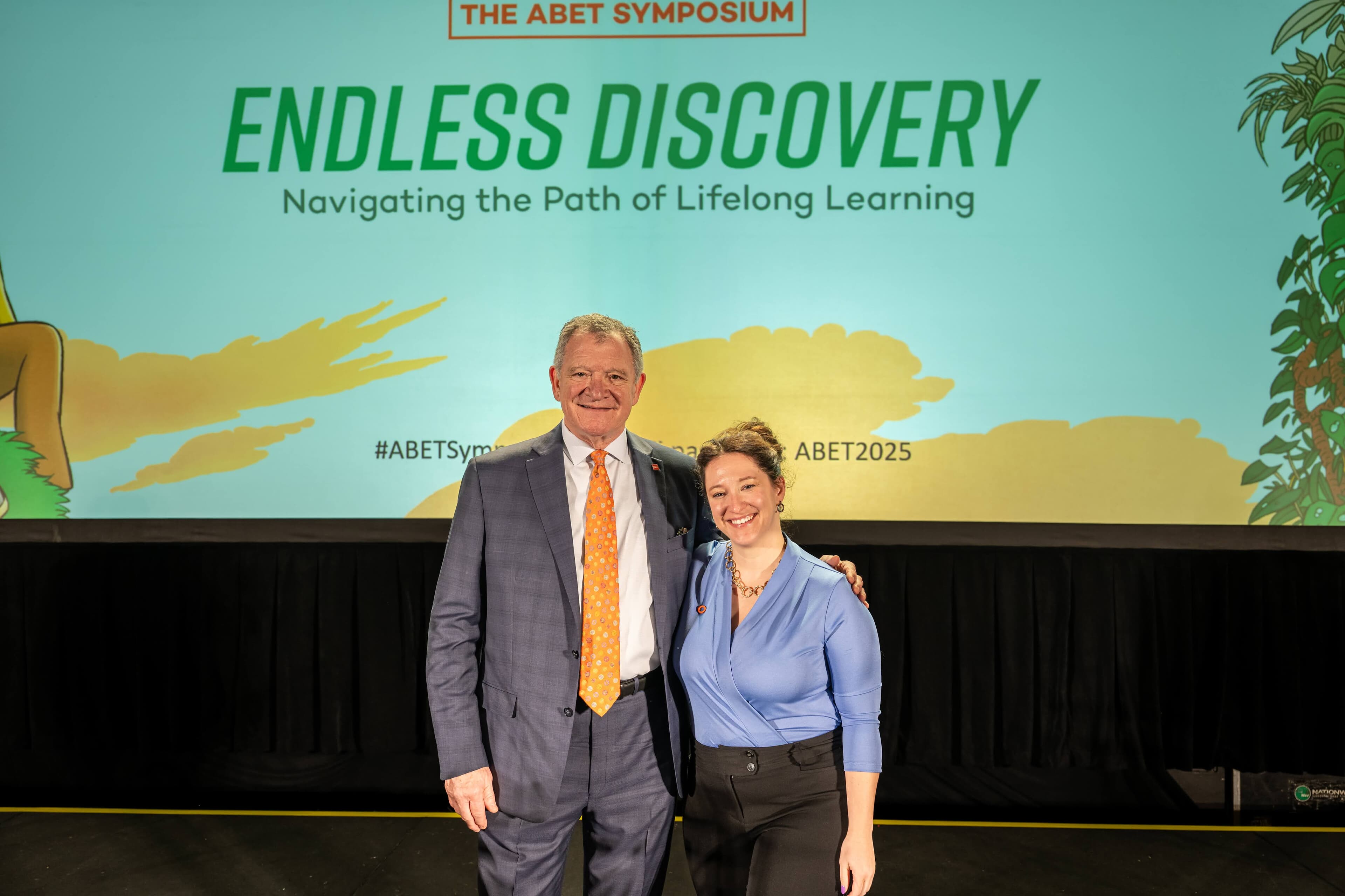 President Rogers smiling with individual