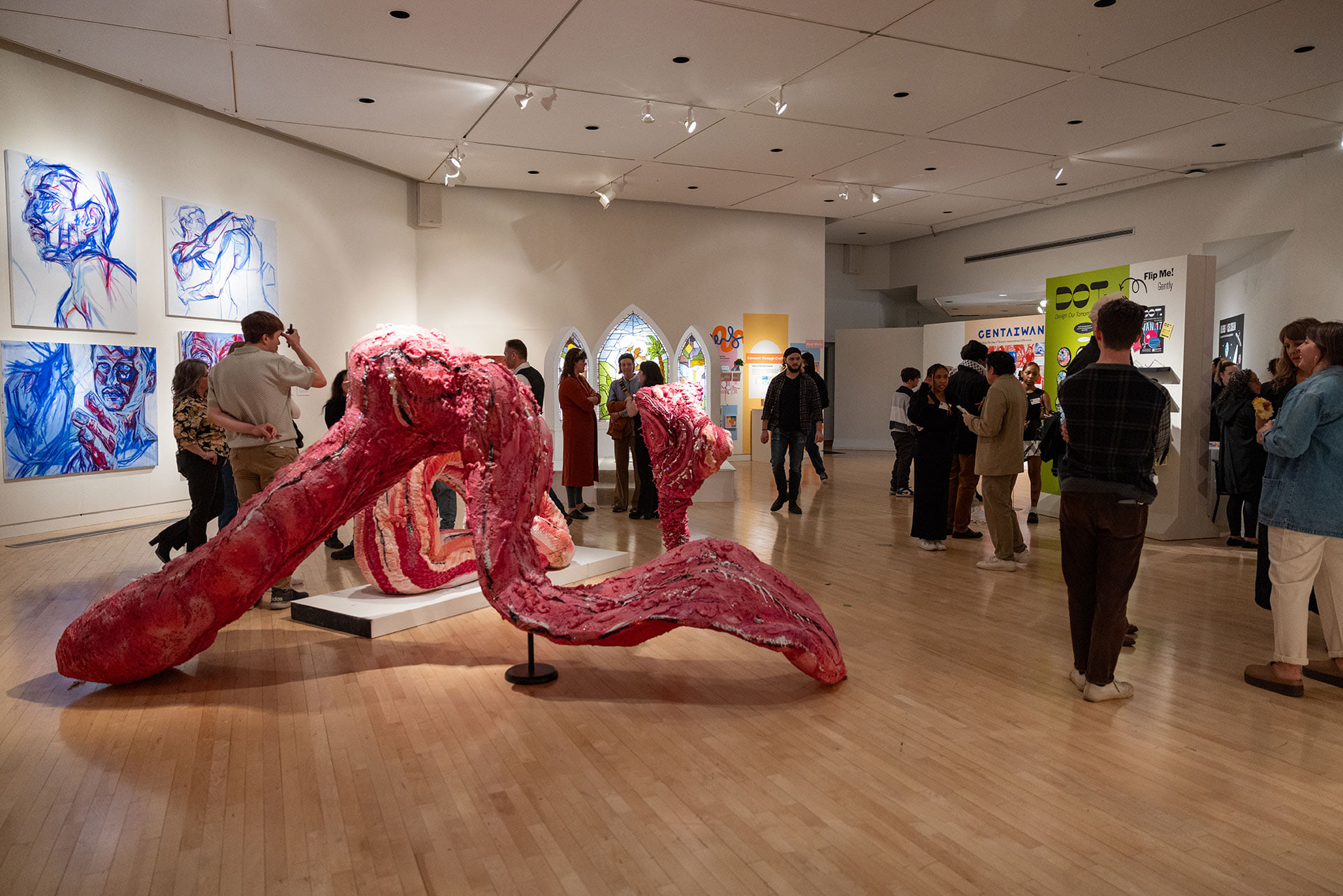 People admiring works of art in a gallery