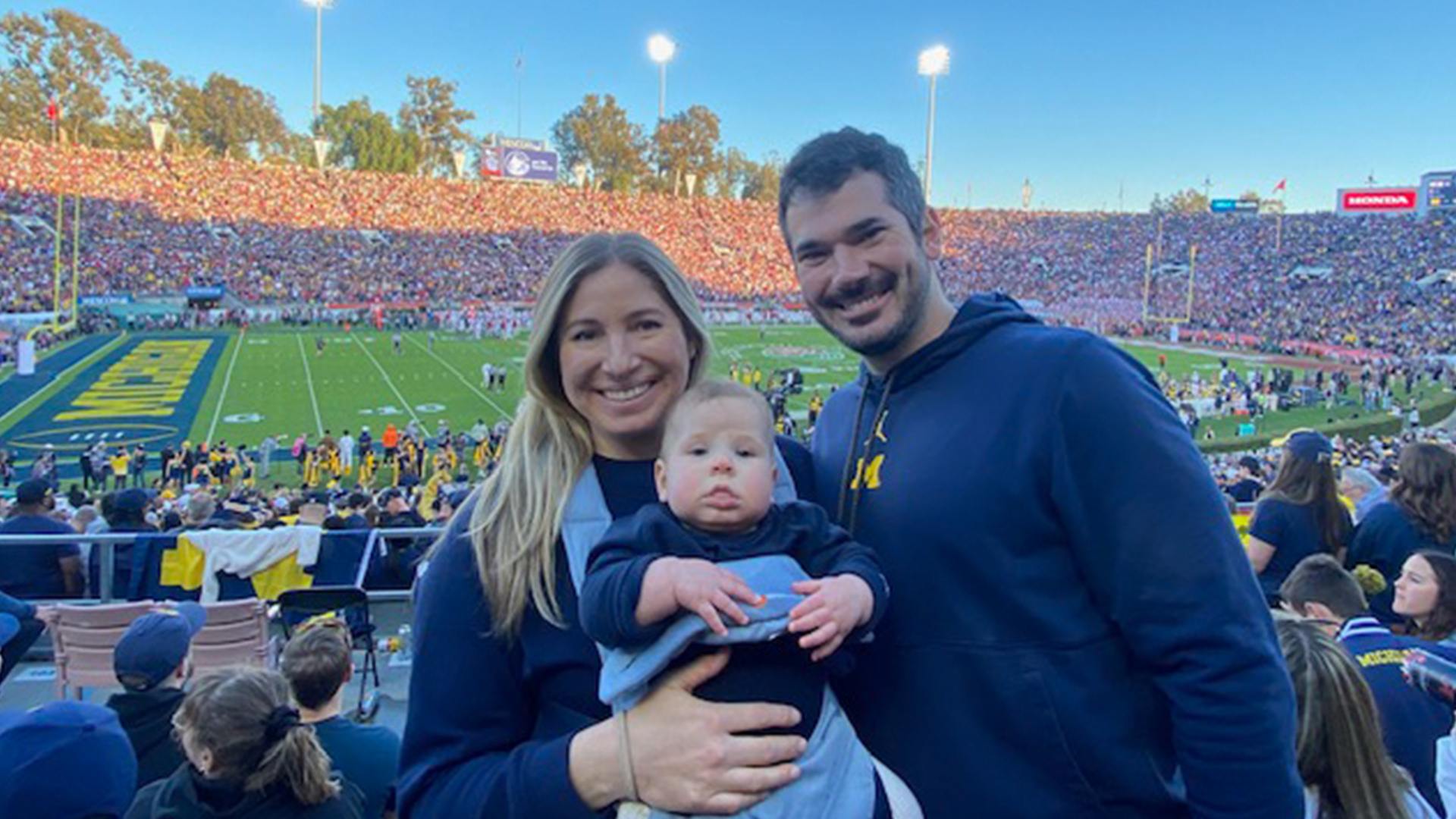 A family poses at the Rose Bowl.
