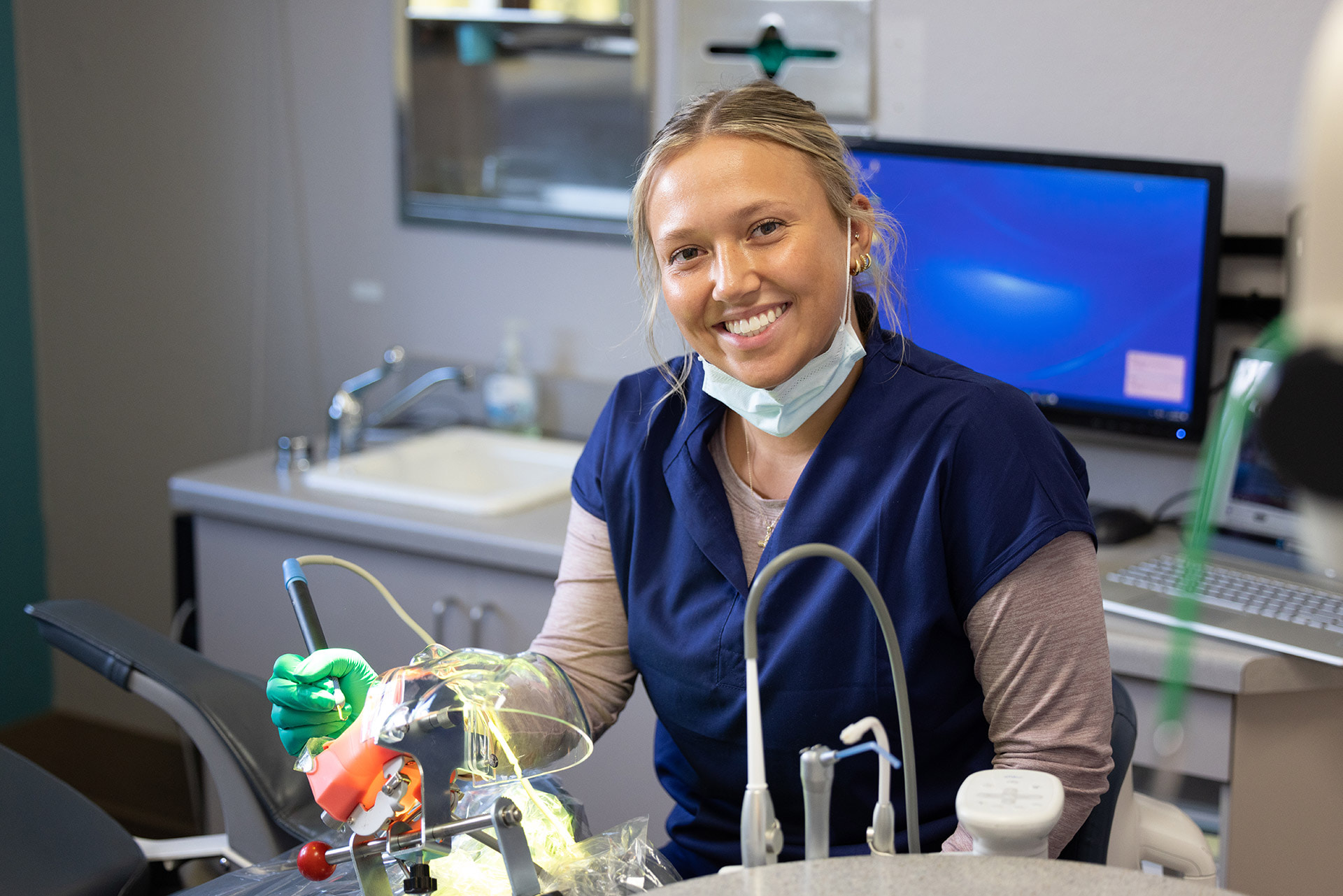 A pre-dental student in a dental office.