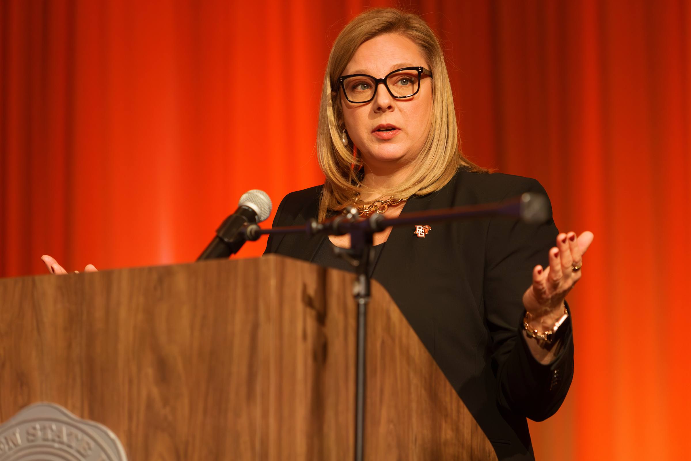 A person speaks at a podium